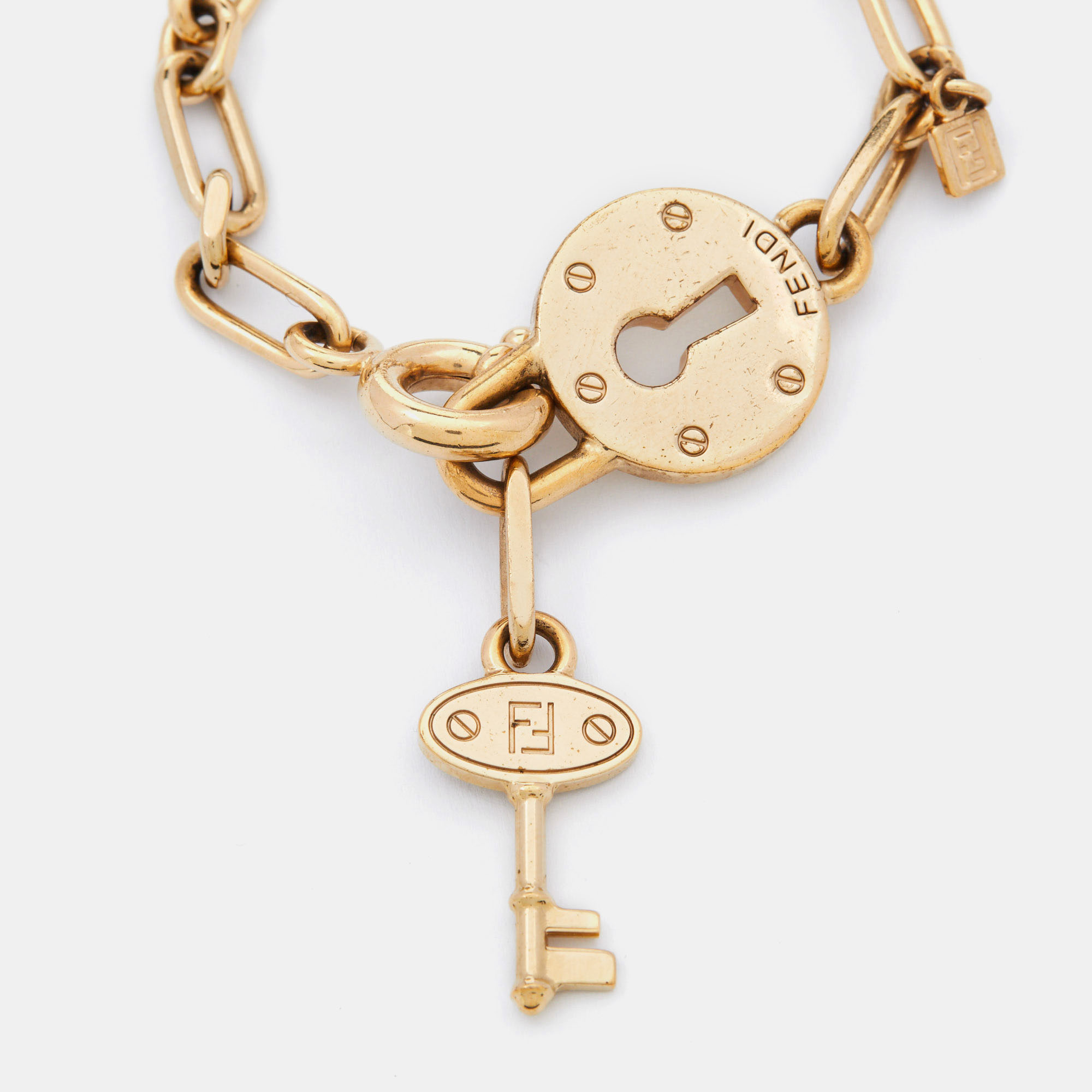 

Fendi Gold Tone Chain Link Lock & Key Bracelet