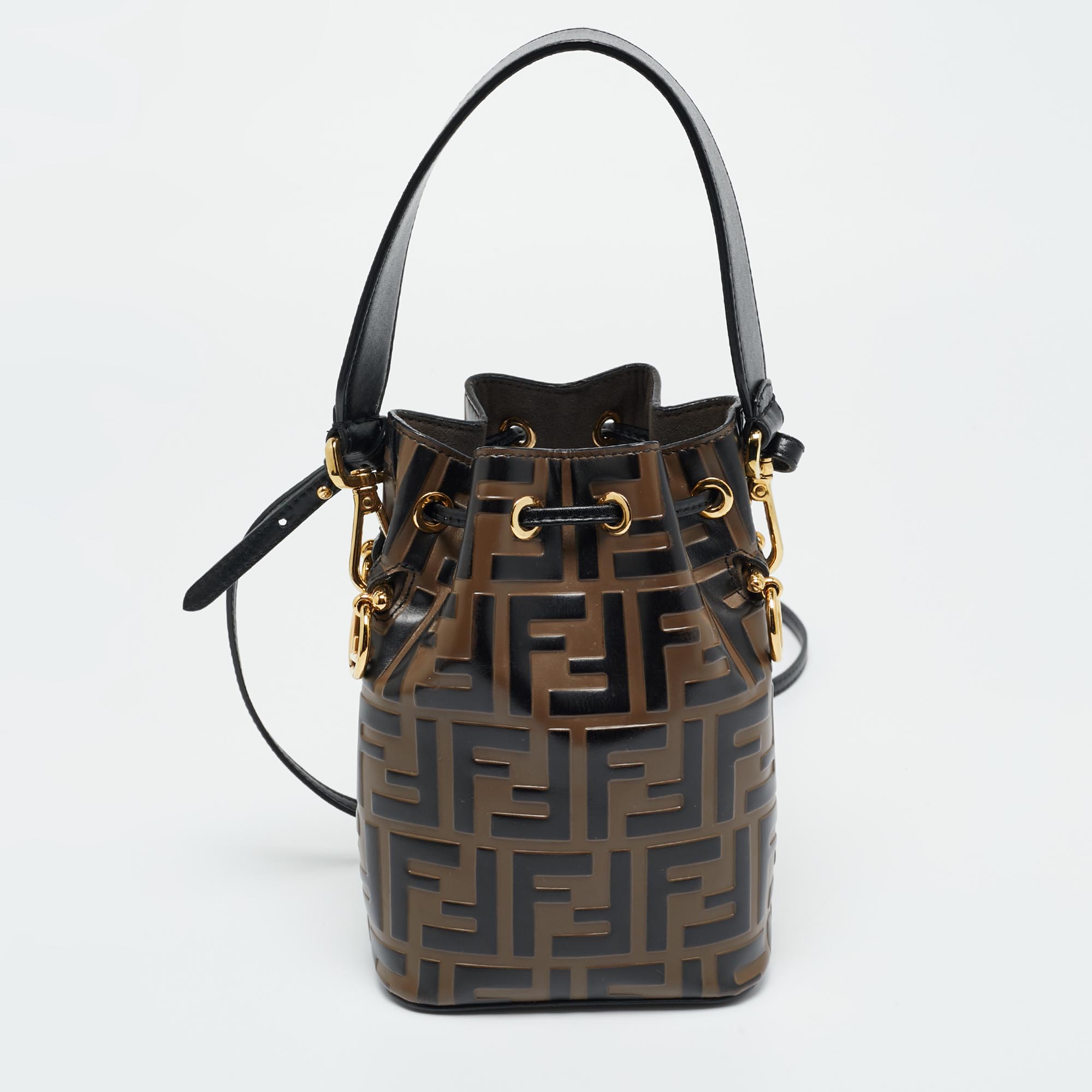 Click to view more detailed imagery on our partner's website Pre-owned Fendi Brown/black Zucca Leather Mini Mon Tresor Drawstring Bucket Bag