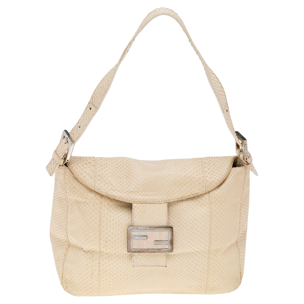 The Mama Baguette shoulder bag from Fendi is an all time classic. It has a light beige python exterior and the Forever lock on the front flap. A spacious satin interior and a single strap complete the fabulous bag.