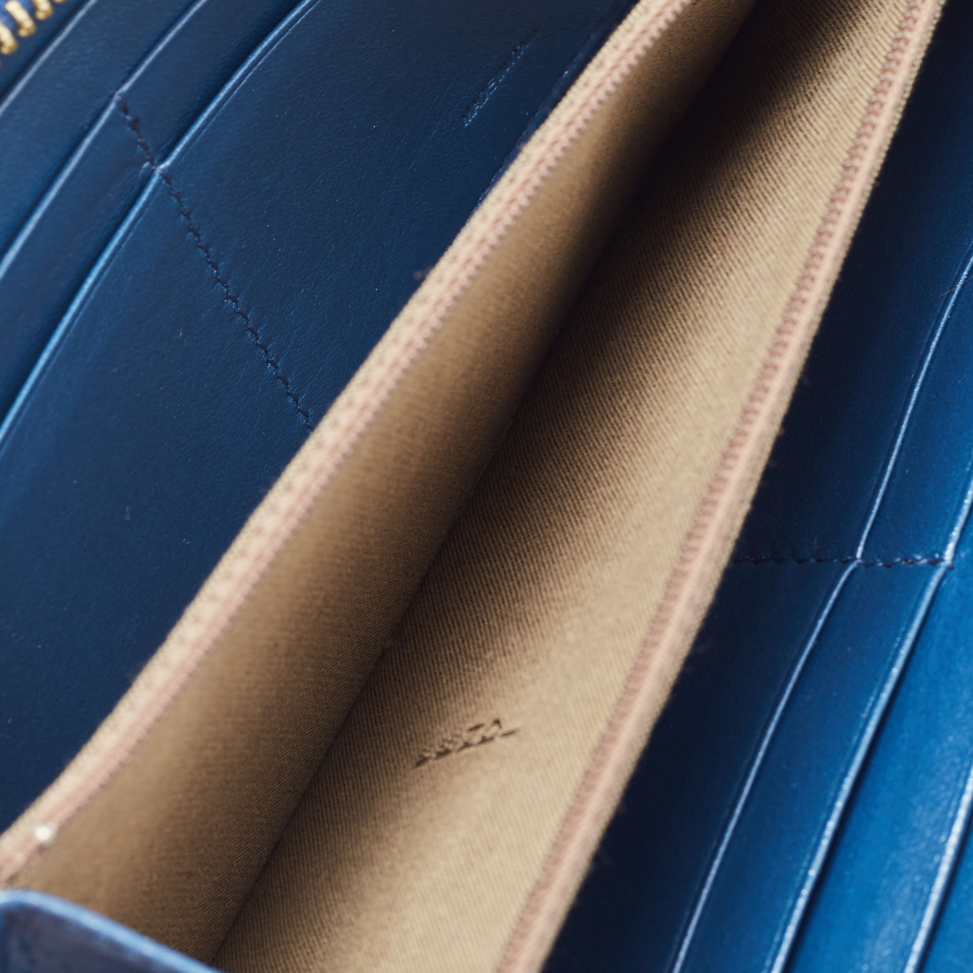 

Fendi Metallic Blue Textured Leather Zip Around Continental Wallet