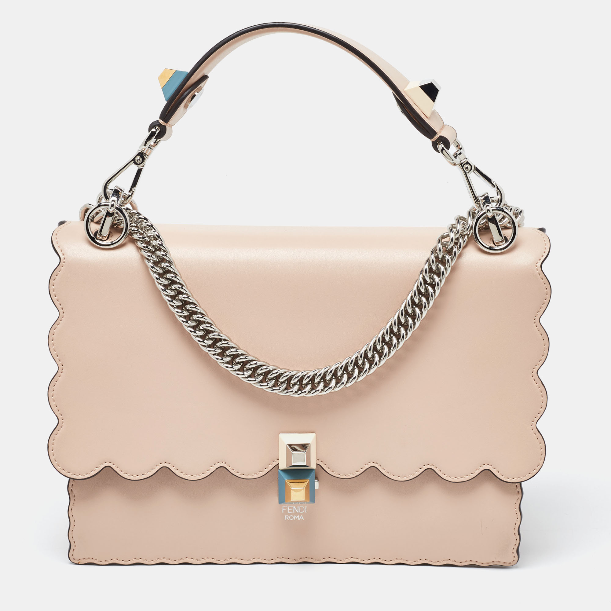 From the Resort 2017 collection the Fendi Kan I bag depicts fun style and alluring appeal. This classic creation is a true piece of art with its striking scalloped trims and faultless craftsmanship. Created from leather its short handle at the top is decorated with beautiful motifs and it also flaunts a chain leather shoulder strap. The bag is stunning with a jewel fastening closure on the front and its suede lined interior will house your valuables comfortably.