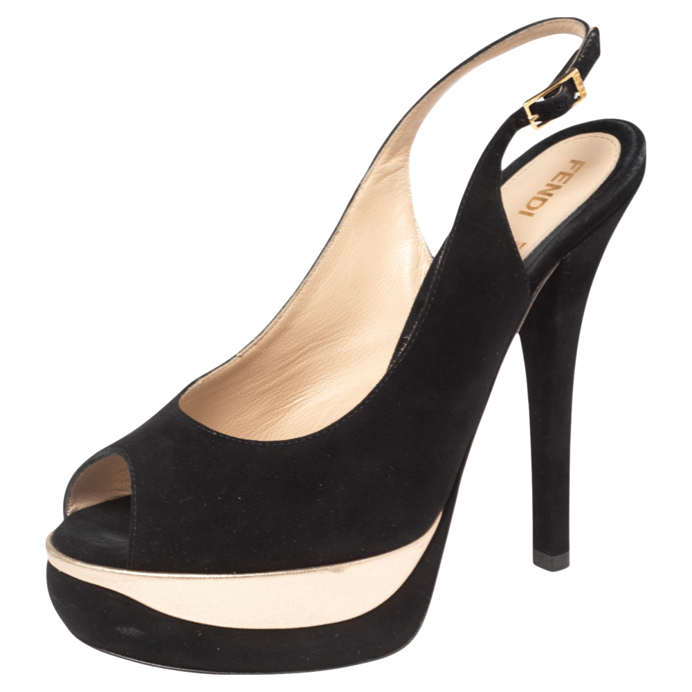 Fendis timeless aesthetic and stellar craftsmanship in shoemaking is evident in these versatile sandals. Crafted from black suede the peep toe silhouette is adorned with sleek cuts and then raised on high heels supported by platforms.