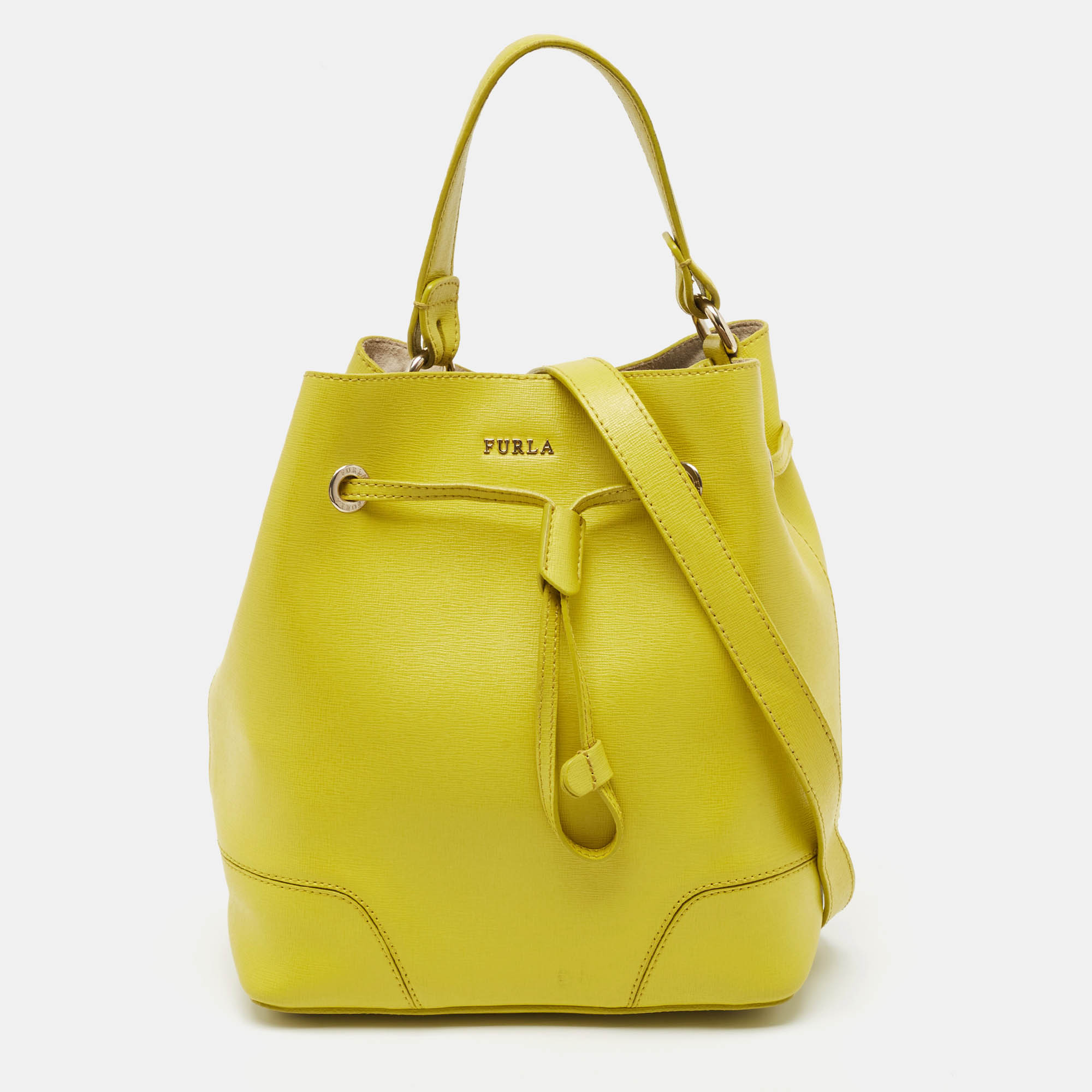 This bag from the house of Furla is an accessory you would go to season after season. It has been crafted from yellow leather in a bucket style and is added with a top handle a drawstring closure and a well lined interior.