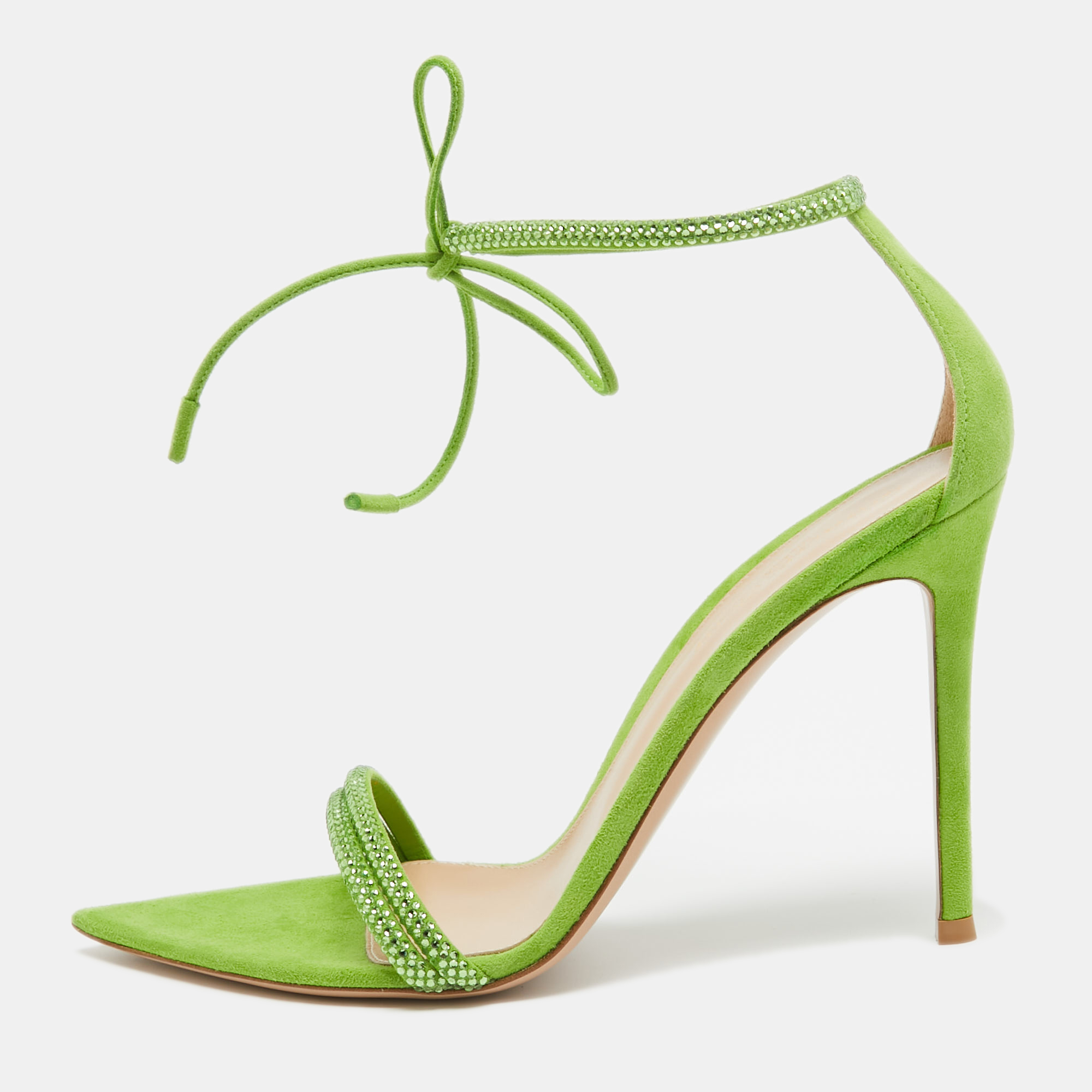 In classy green suede the Gianvito Rossi Montecarlo sandals exude confident charm. Delicate straps gracefully embrace the foot while a sturdy heel provides stability and style. With impeccable craftsmanship and timeless design these sandals effortlessly command attention adding a bold statement to any ensemble