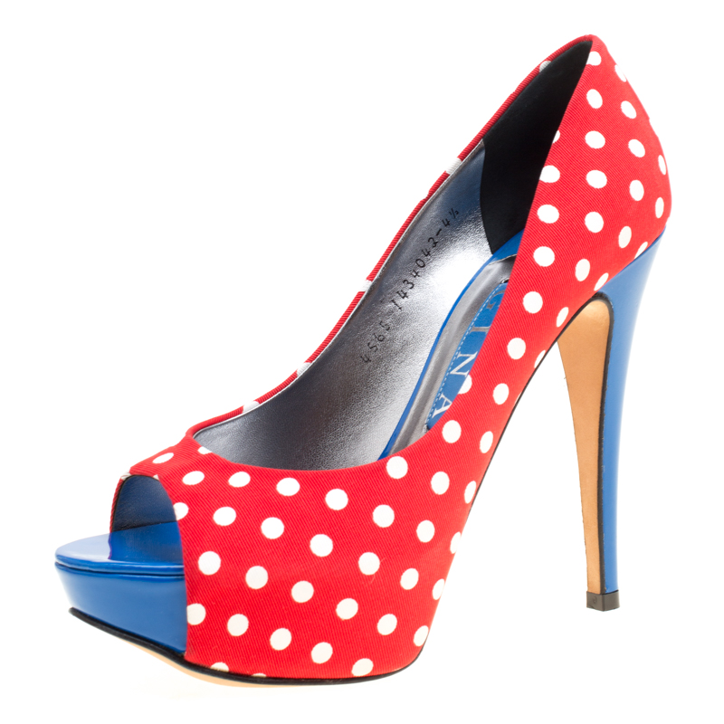 Designed for day time parties and events these Gina pumps are one for the fun and flirty woman who is not afraid to experiment Constructed in polka dot printed canvas these peep toe pumps are accented with blue leather insoles for an added pop of color along with the comfortable platforms to balance the high heels.