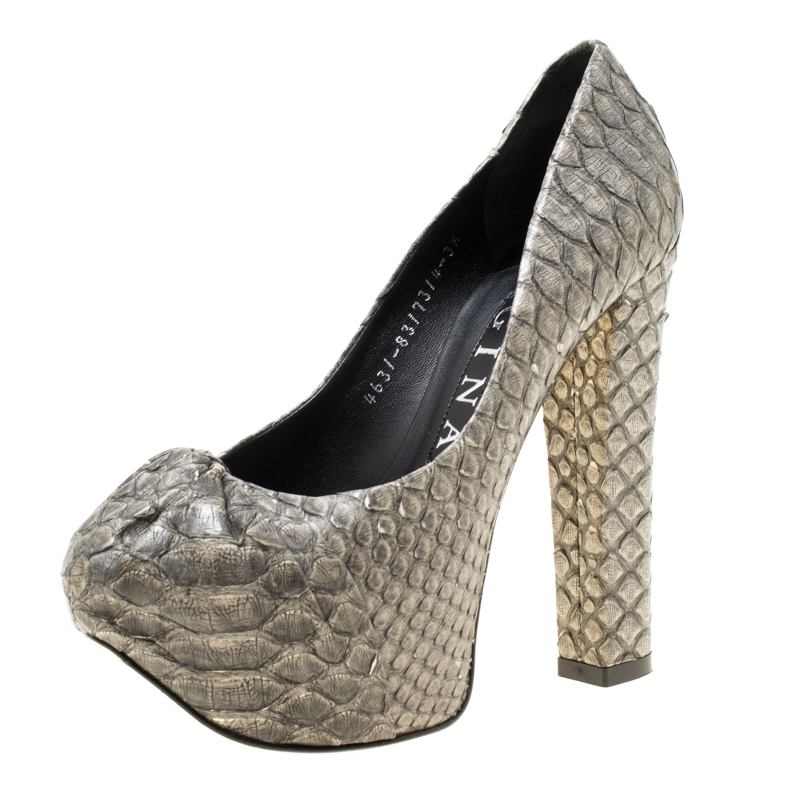 Strut your way in style and dazzle the crowds in these grey Claire pumps from Gina These gorgeous pumps are crafted from python and feature a hood detailing on the vamps. They come equipped with comfortable leather lined insoles 14 cm block heels and concealed platforms that offer maximum grip while walking. This is one pair you definitely cannot miss buying