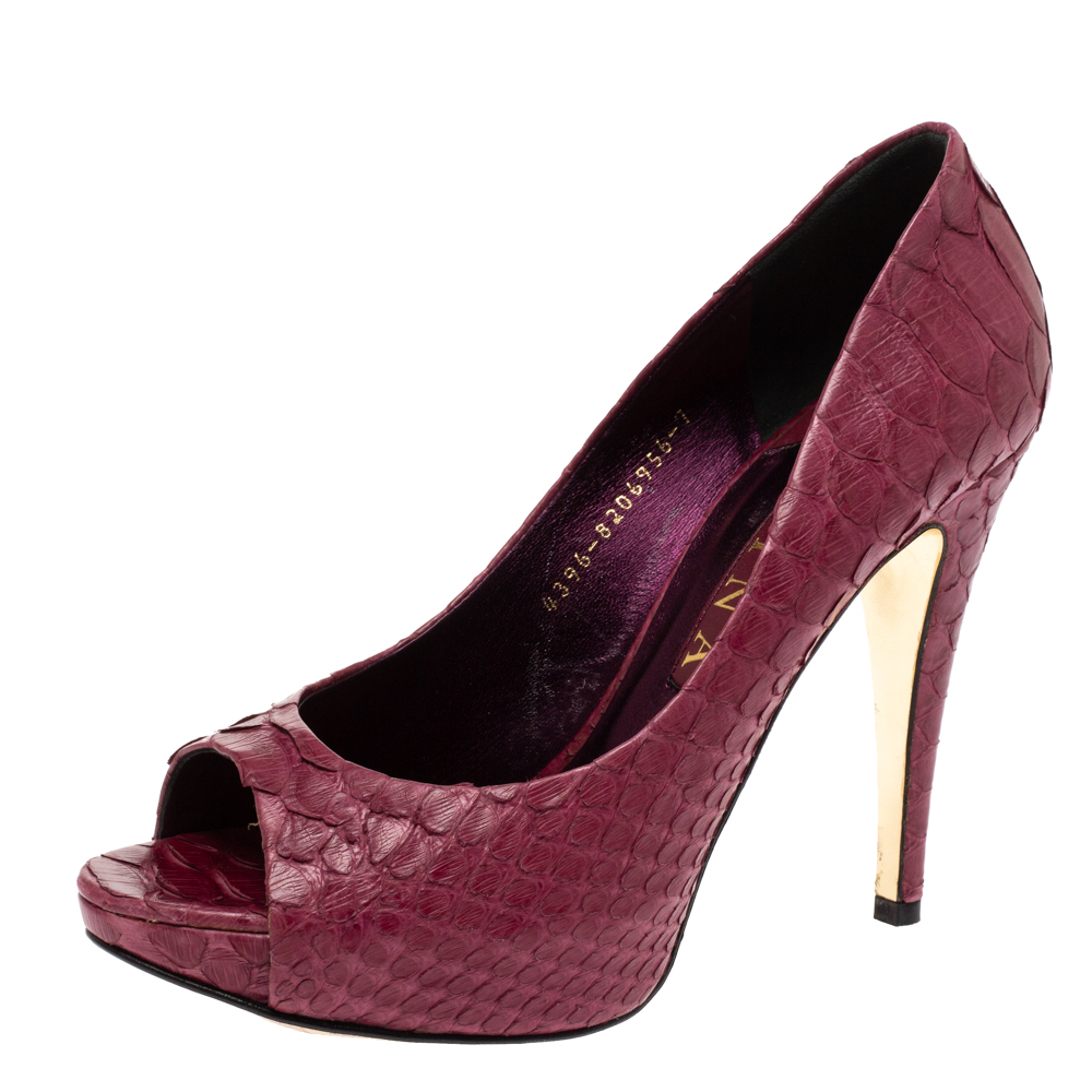 Admired for their exquisite craftsmanship Gina displays some of the best pumps for all occasions. Crafted from python these pumps are a splendid example of luxury and class. They feature peep toes and come equipped with comfortable leather lined insoles and 12.5 cm heels supported by platforms. NOTE: (Available for UAE Customers Only)