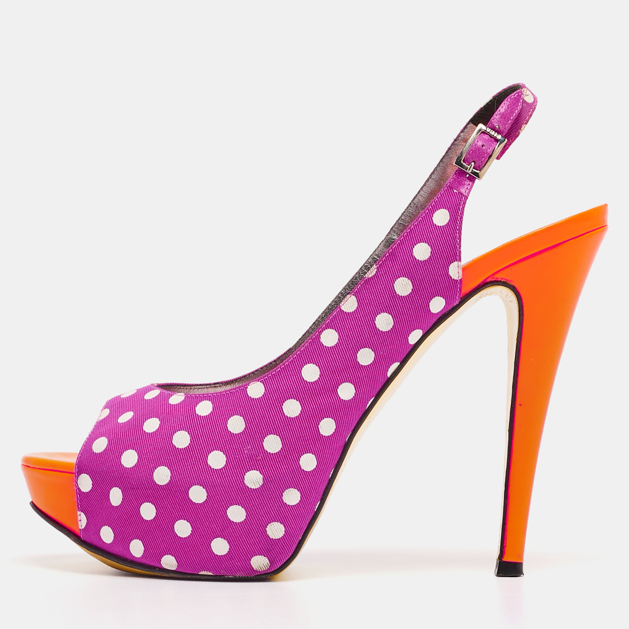 Designed for day time parties and events these Gina pumps are one for the fun and flirty woman who is not afraid to experiment Constructed in polka dot printed canvas these peep toe pumps are accented with blue leather insoles for an added pop of color along with the comfortable platforms to balance the high heels.