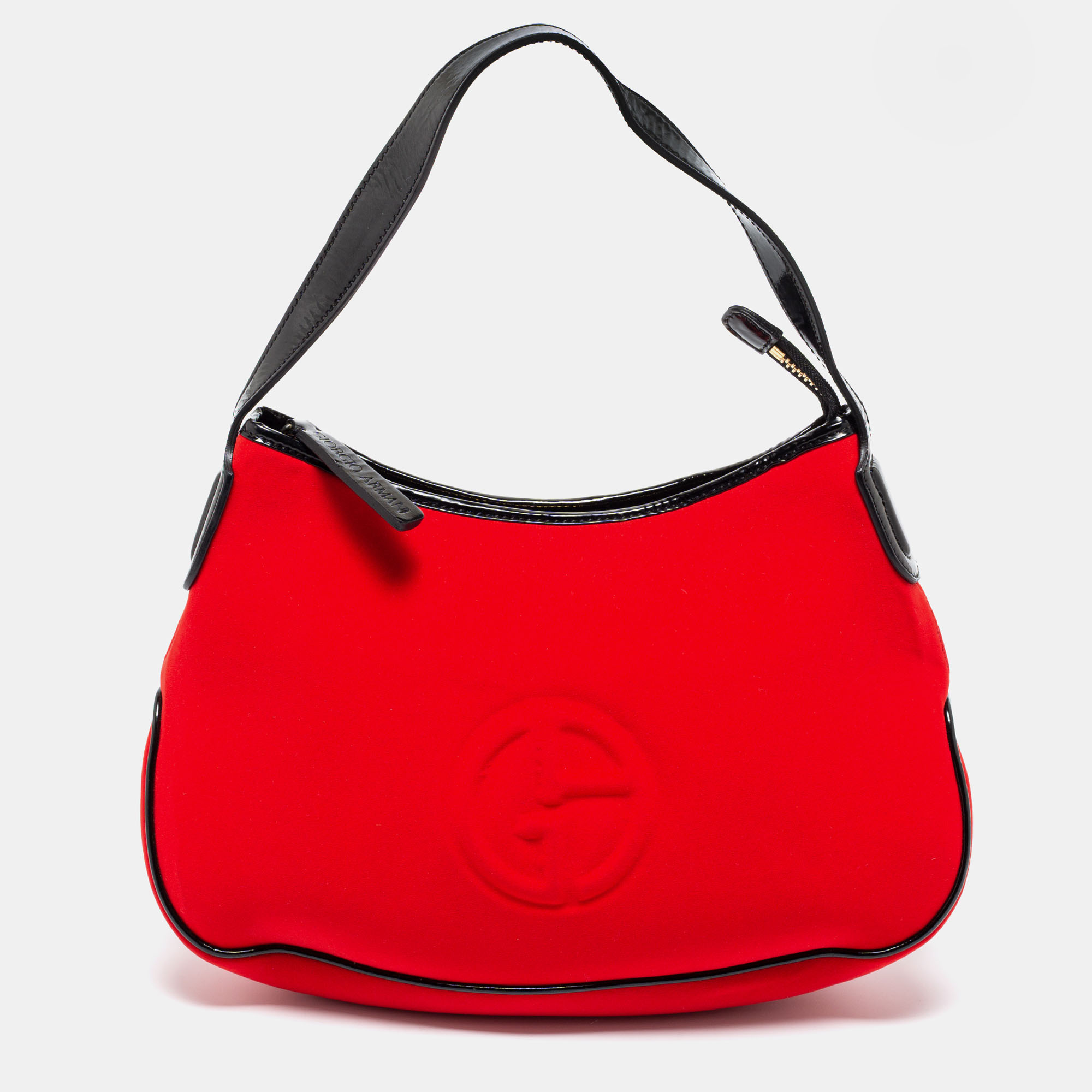 The hobo by Giorgio Armani is an everyday friendly handbag. It is crafted from red neoprene and added with black patent leather trims. This hobo features a top zip closure a lined interior and a single handle.