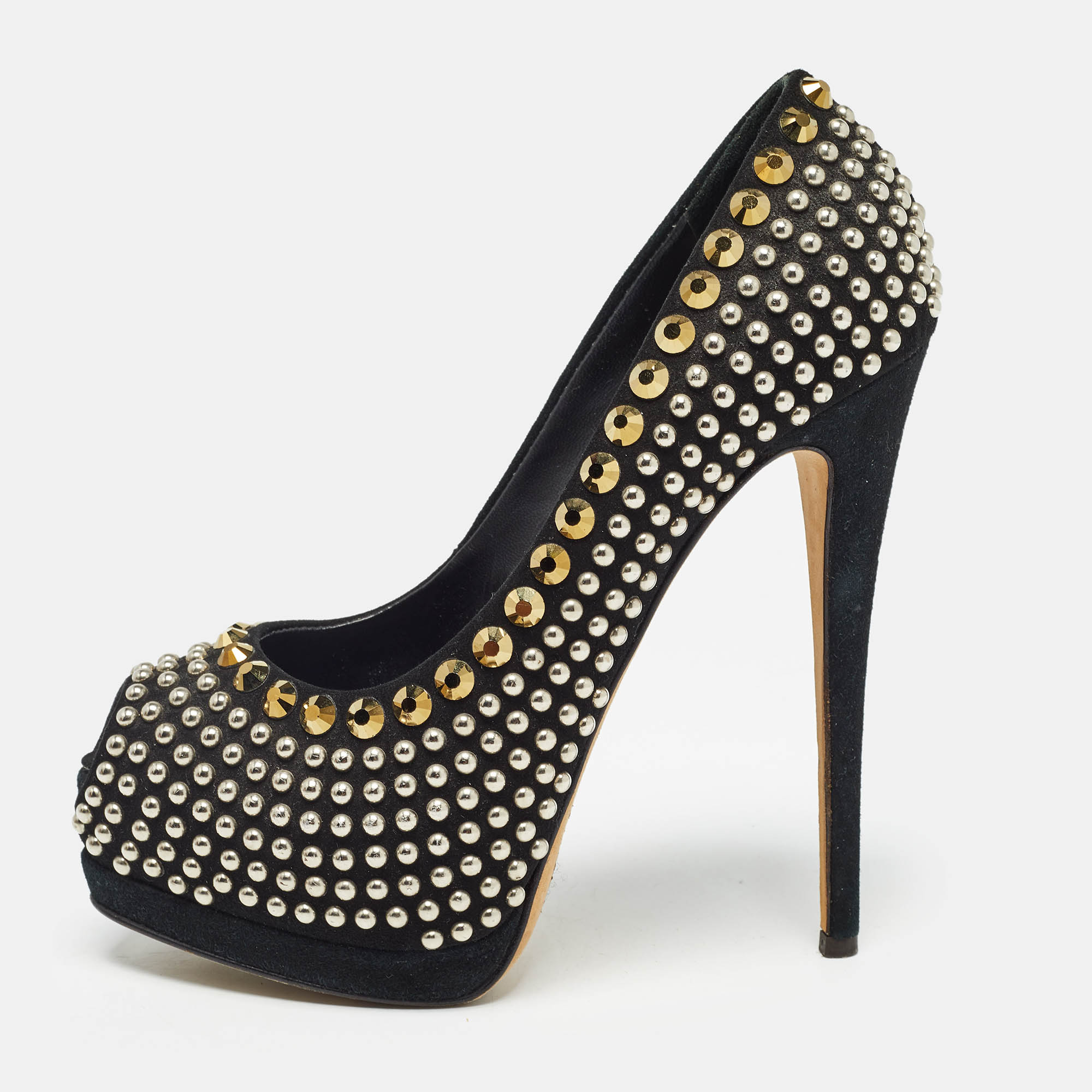 Get set to dazzle the crowds with these peep toe pumps from Giuseppe Zanotti. The black pair is crafted from suede and looks ethereal with its fabulous craftsmanship. The pumps flaunt stud embellishments solid platforms offering maximum comfort and a 15 cm towering heel. Pair these with a slit gown or a pleated dress and a cocktail ring for a fashionable dinner date.