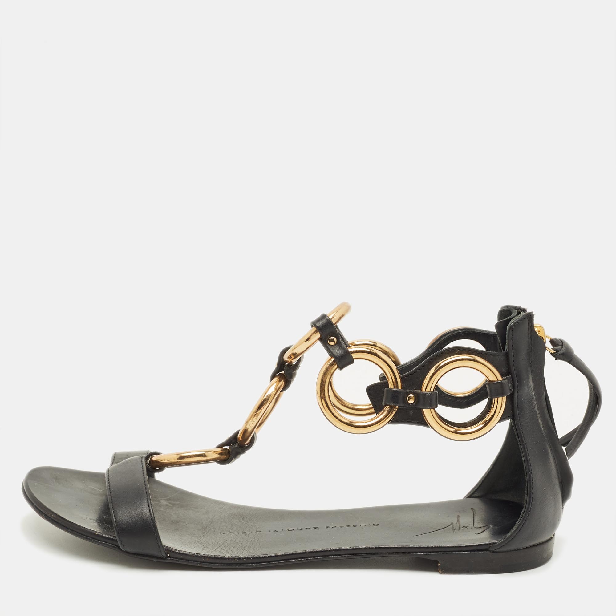 Click to view more detailed imagery on our partner's website Pre-owned Giuseppe Zanotti Size 36 Black Leather And Metal T Strap Flat Sandals
