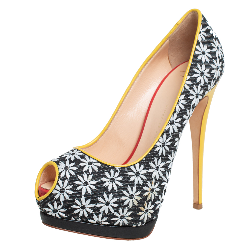 Own this meticulously designed pair of Giuseppe Zanotti pumps today and dazzle everyone whenever you step out Crafted out of floral printed fabric and leather these pumps feature peep toes. They have been beautified with 14 cm heels and solid platforms.