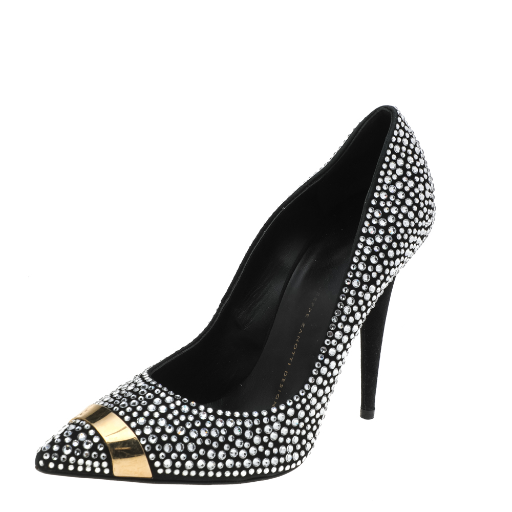Revamp your footwear collection by adding this pair of shimmering Giuseppe Zanotti pumps to your wardrobe. The black pumps are crafted from suede and feature exquisite crystal embellishments adorning the exterior. Pointed toes with gold tone hardware detailing comfortable leather lined insoles and 11 cm heels complete this stunning pair.