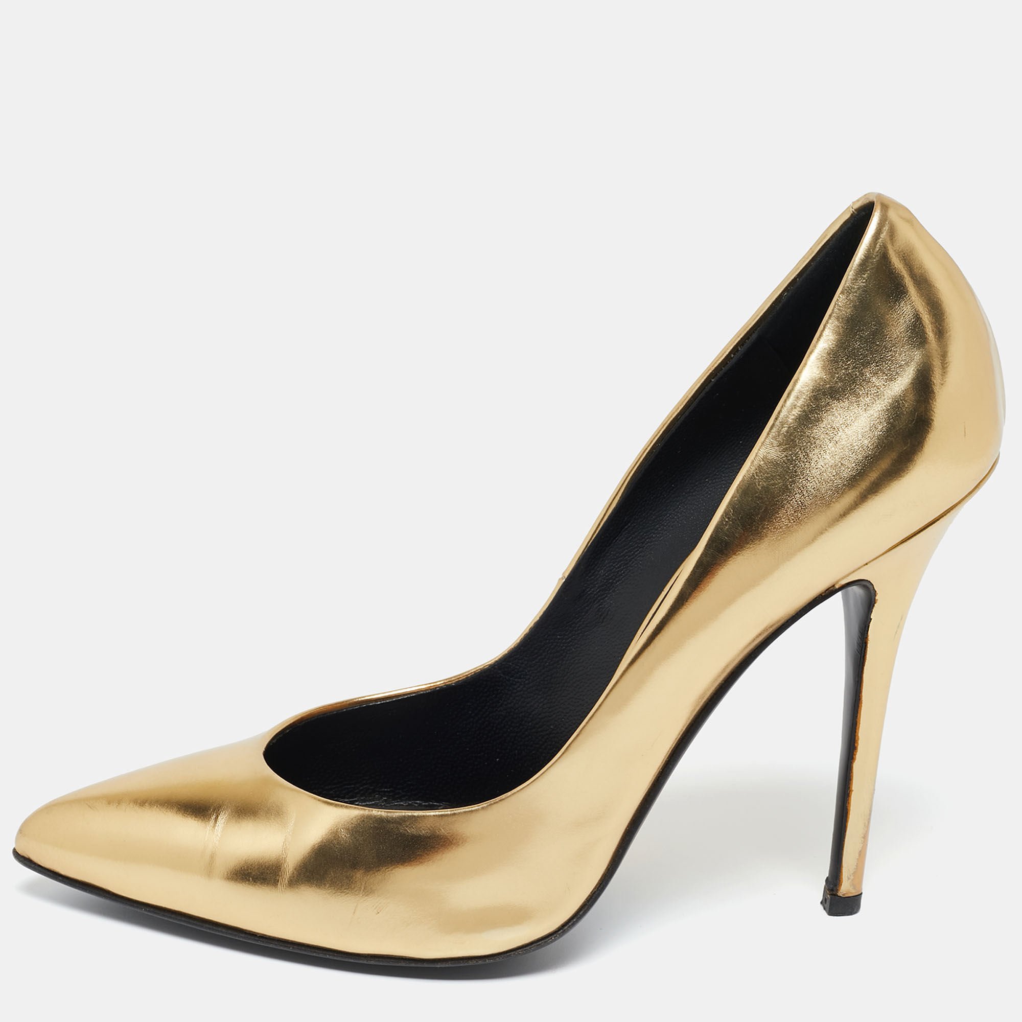 There are some shoes that stand the test of time and fashion cycles these timeless Giuseppe Zanotti pumps are the one. Crafted from leather in a gold shade they are designed with sleek cuts pointed toes and tall heels.