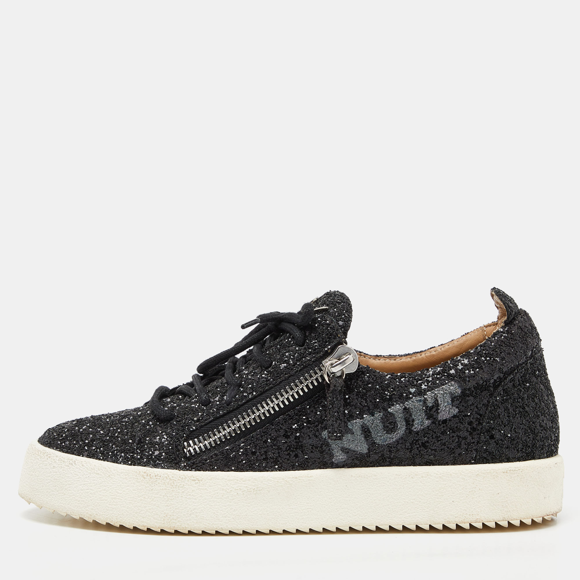 These low top sneakers from Giuseppe Zanotti are gorgeous. They have been crafted from black glitter and detailed with double zippers on the sides and brand logos on the tongues. Comfortable leather lined insoles and durable rubber soles complete this fabulous pair.