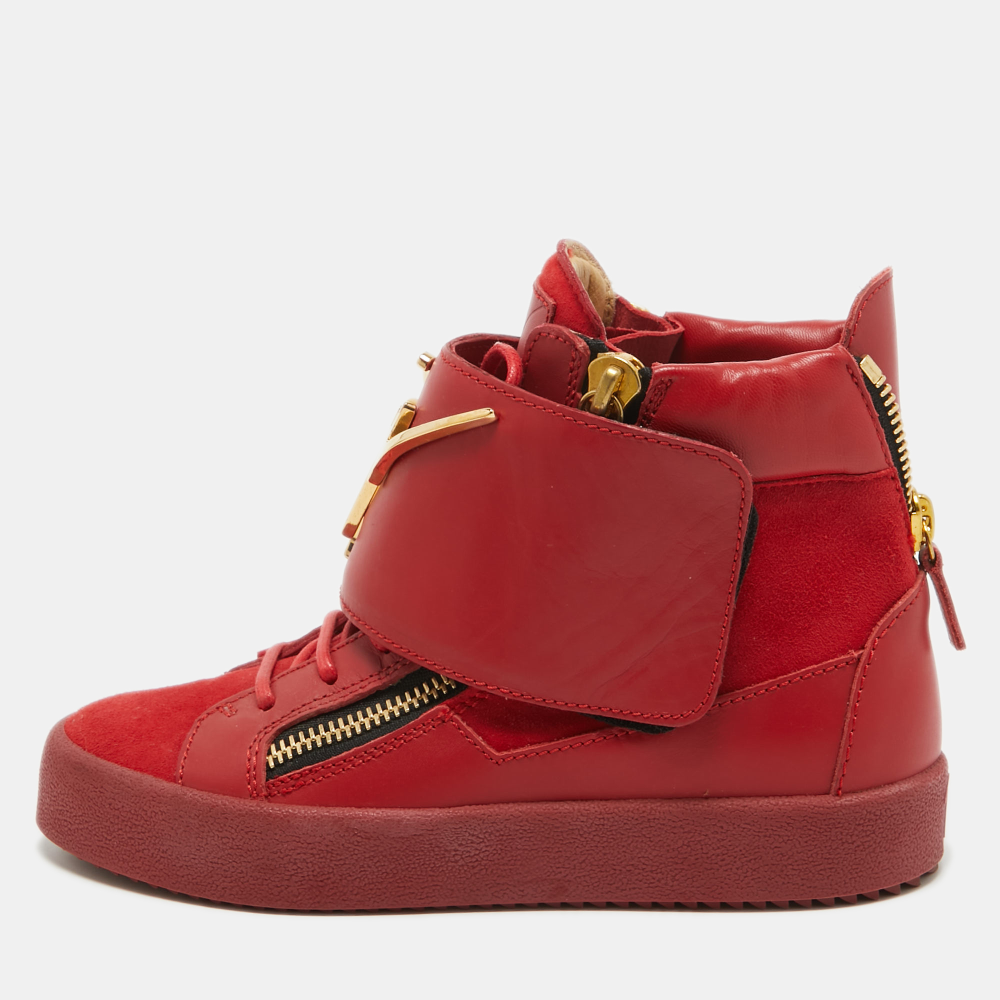 These high top sneakers from Giuseppe Zanotti are astoundingly beautiful. They have been crafted from red suede and leather and styled with round toes lace ups on the vamps gold tone logo detailed wide velcro straps double zippers on the sides and single zippers on the heel counters. Comfortable leather lined insoles and durable rubber soles complete this fabulous pair.