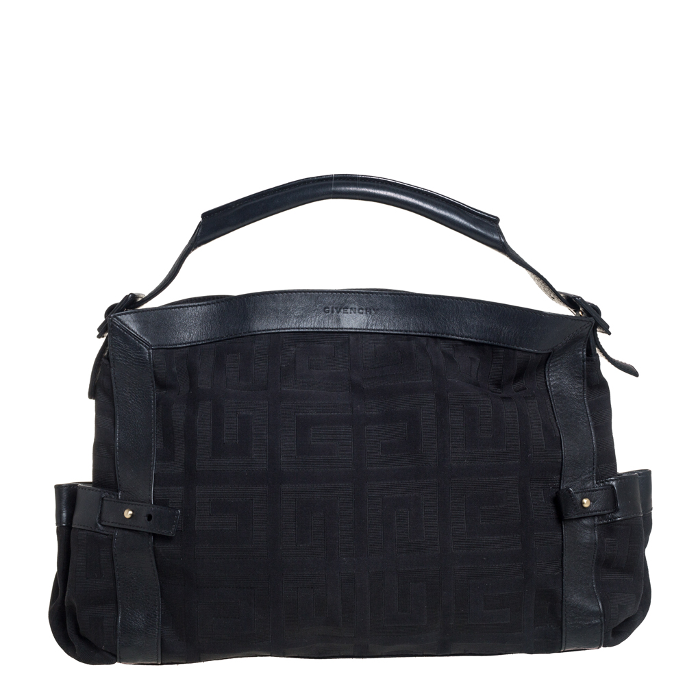 This black satchel from Givenchy will give you days of style and ease. It is crafted from the signature canvas and leather and features gold tone hardware. It is equipped with a spacious fabric interior and a single top handle and it flaunts an embossed brand logo detailing on the front.