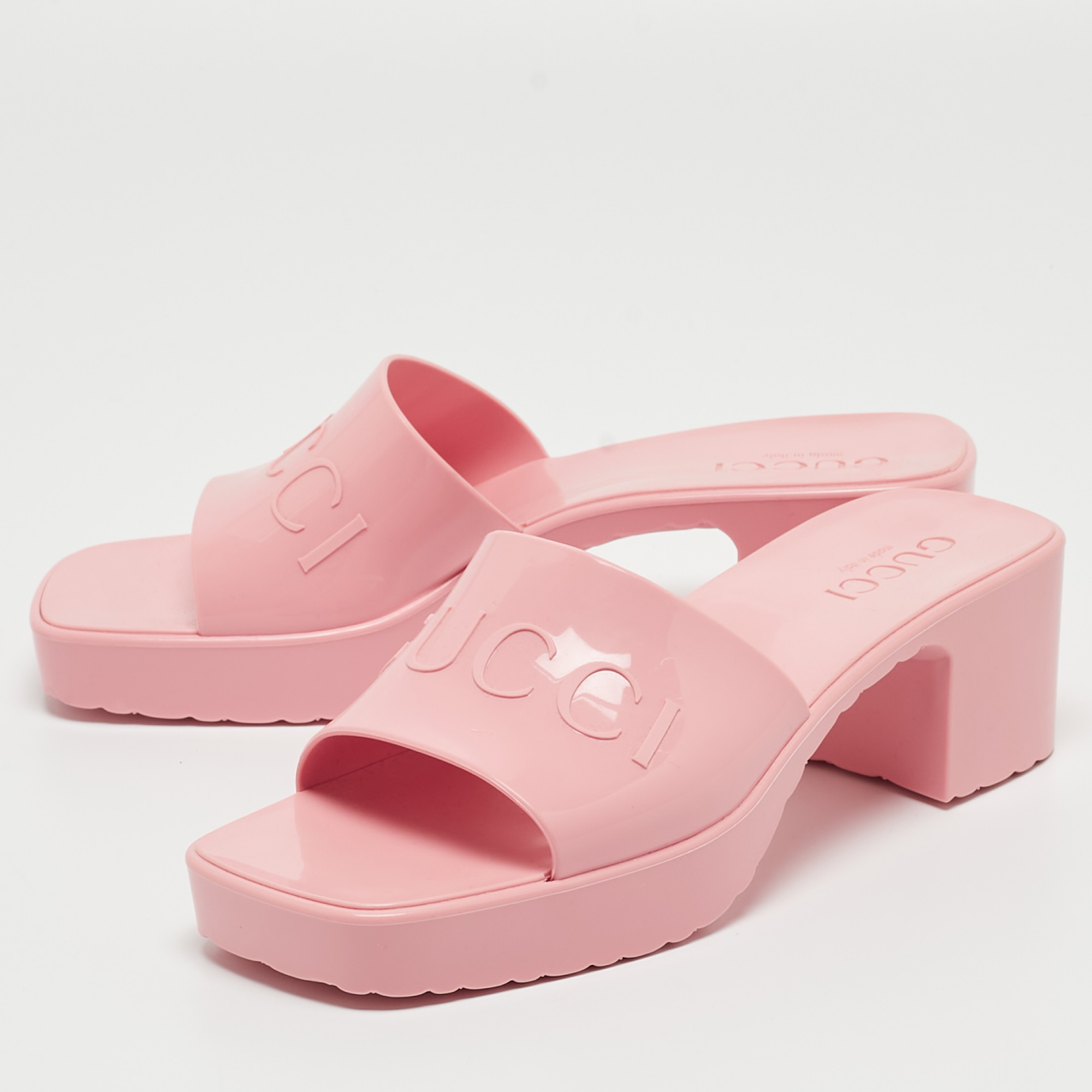 

Gucci Pink Rubber Logo Mules Size