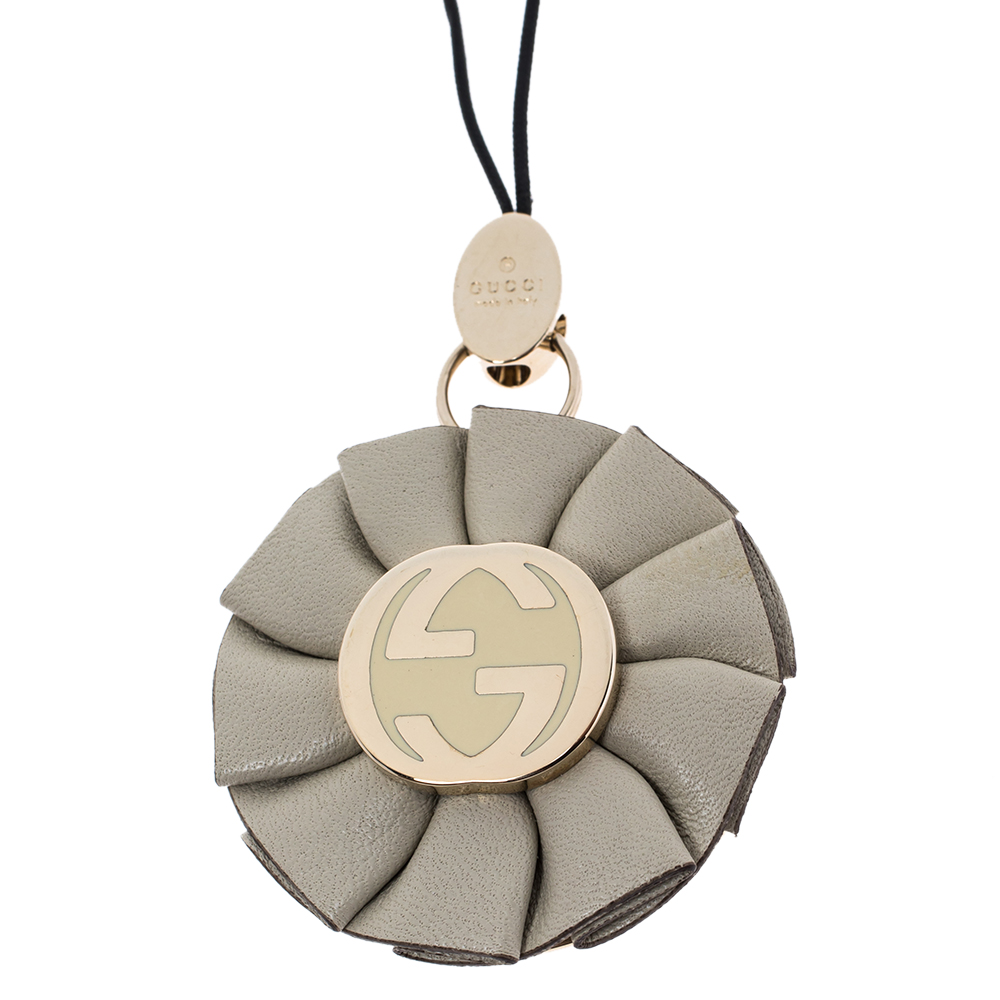 

Gucci GG Enamel Leather Gold Tone Floral Cell Phone Charm, Beige