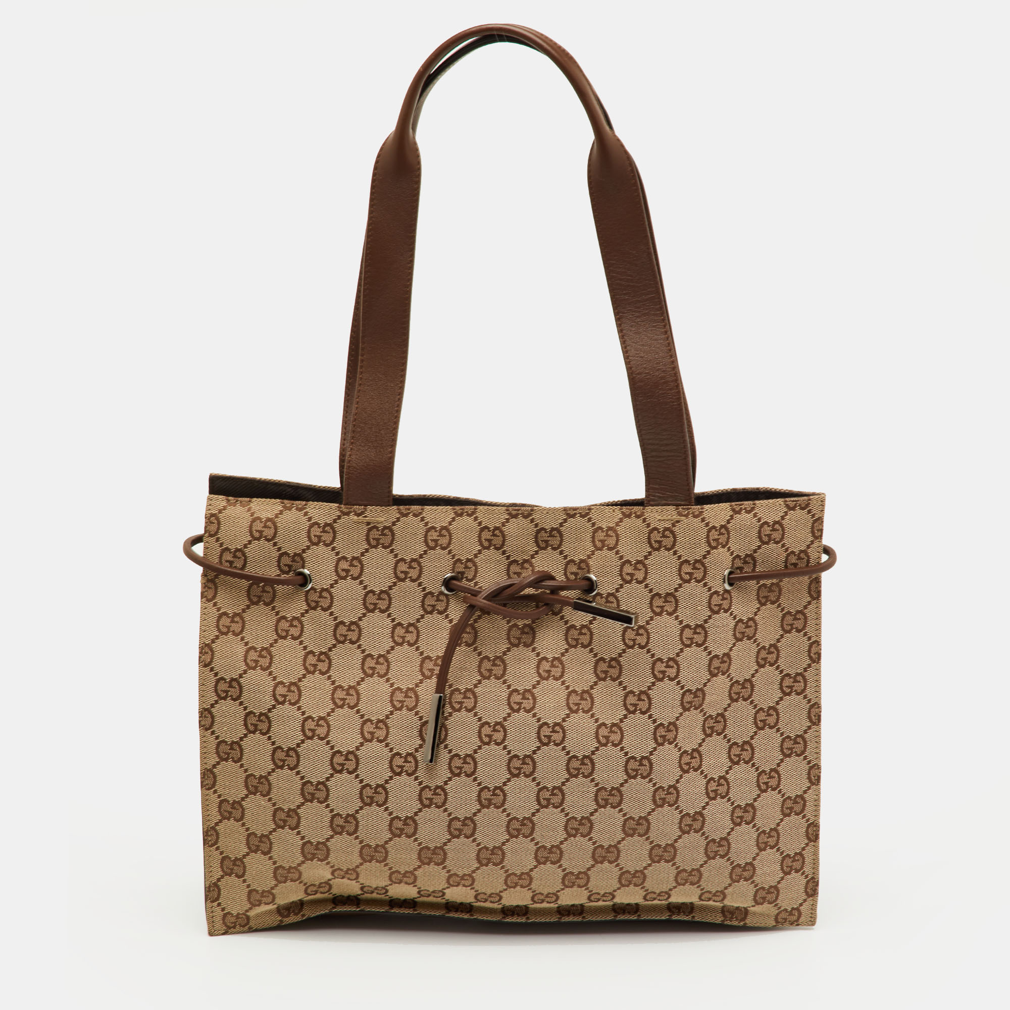 Pre-owned Gucci Beige/brown Gg Canvas And Leather Drawstring Tote In Sand