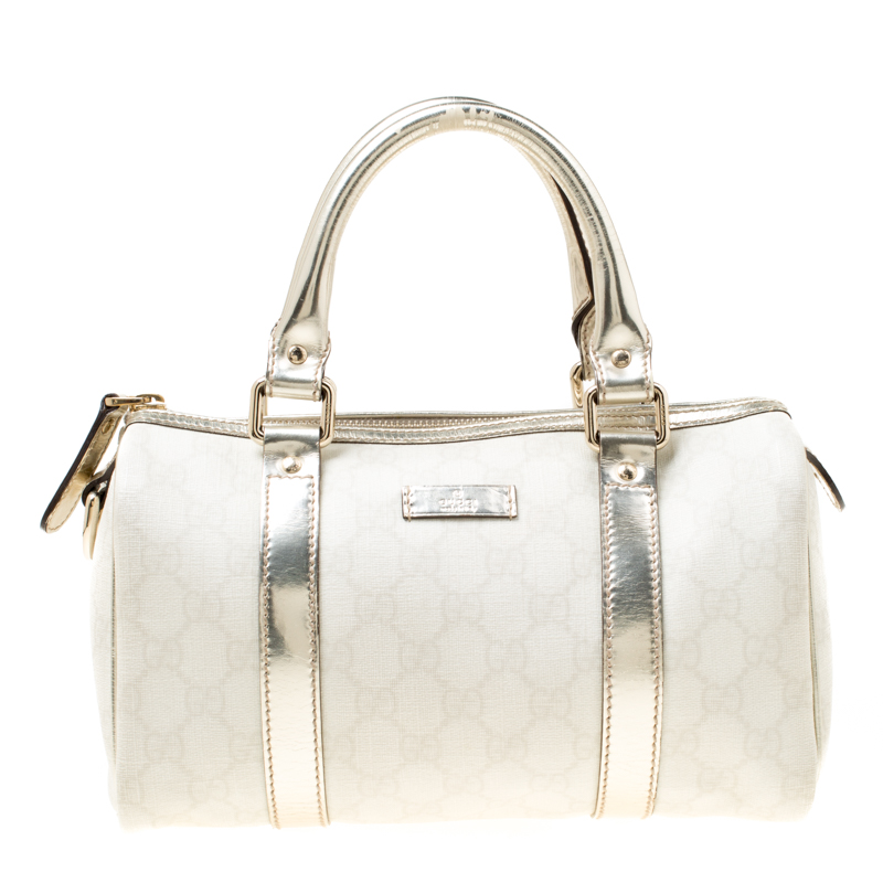 white and gold gucci bag