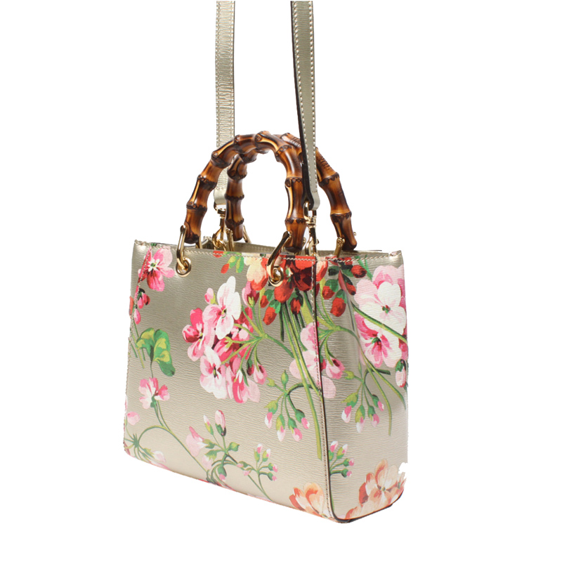 

Gucci Gold Leather Floral Bamboo Top Handle Bag