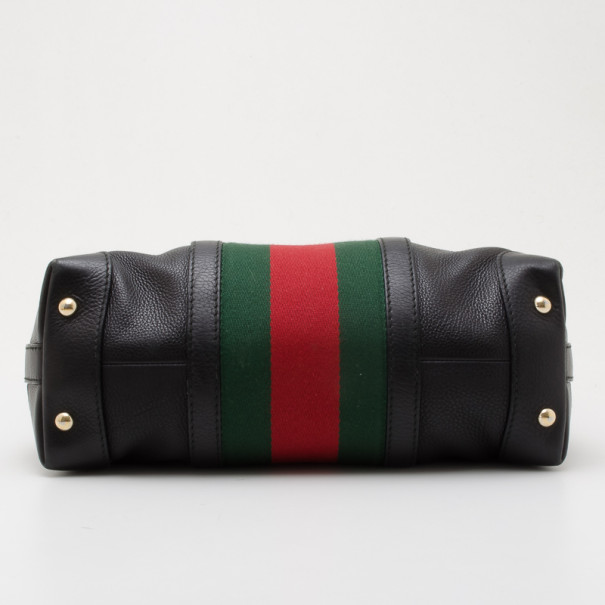 black gucci handbag with red and green strap