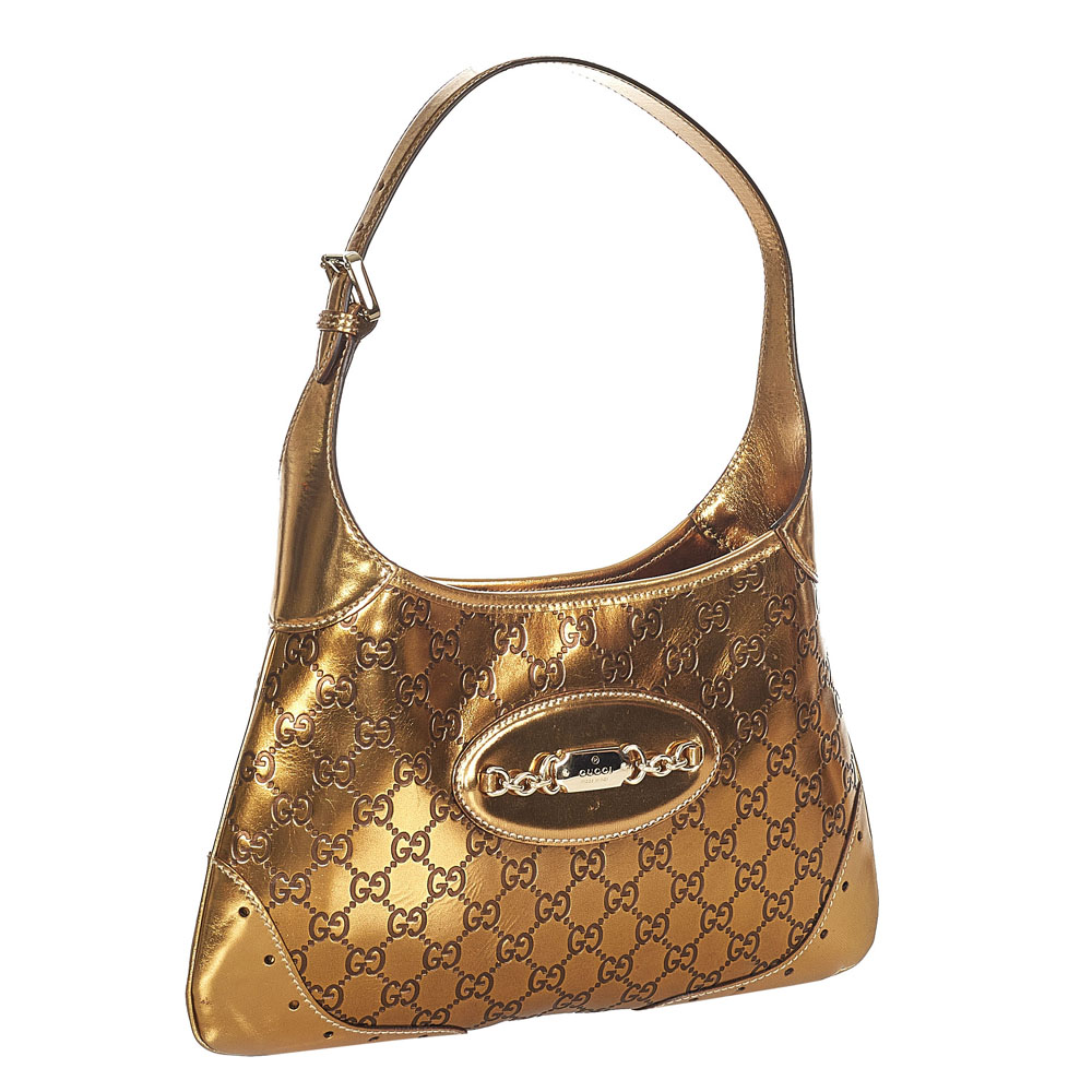 

Gucci Gold Leather Punch Hobo Bag