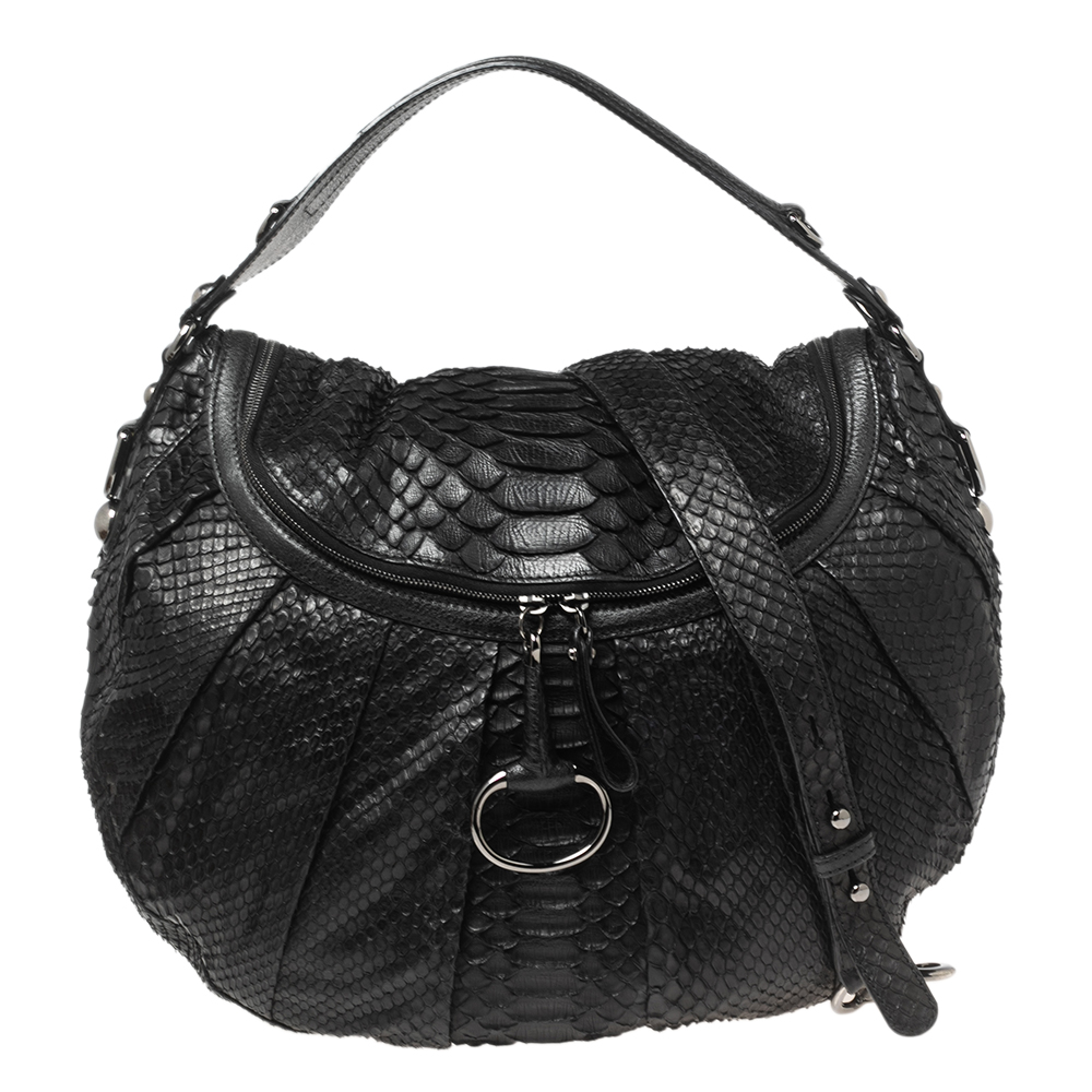 Another fine example of Guccis regard for craftsmanship and style is seen in this hobo It is made of python and leather and has the Bit accent as one of the zipper pulls. It is held by a top handle and a shoulder strap for versatile carrying options.