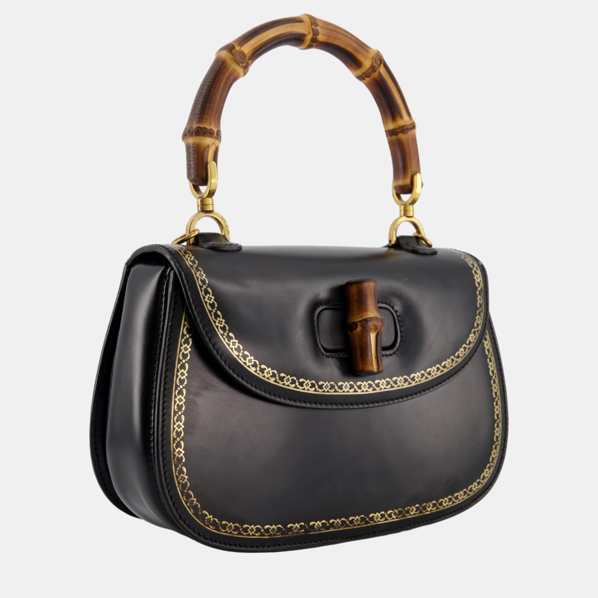 

Gucci Fall/Winter 2017 Black with Gold Trim Print Bamboo Top Handle Bag
