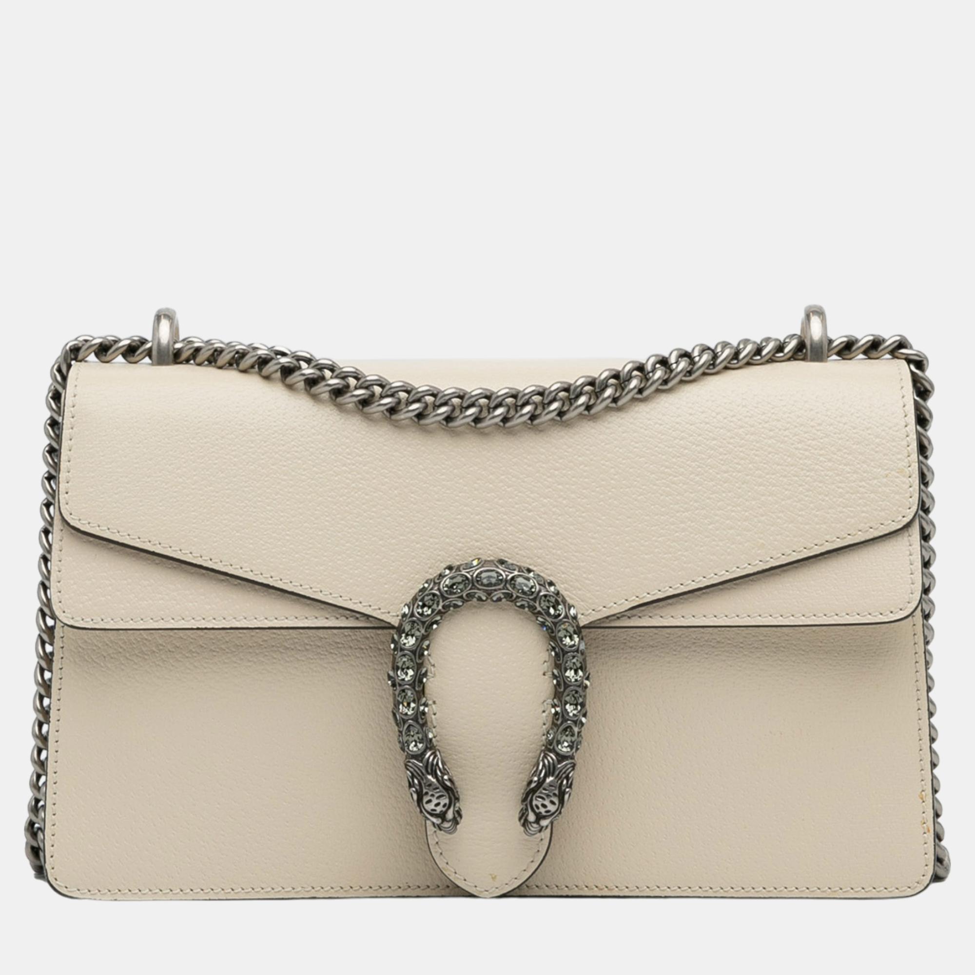 The Small Dionysus shoulder bag features a leather body a curb chain shoulder strap a flap with magnetic snap closure and an interior zip pocket.