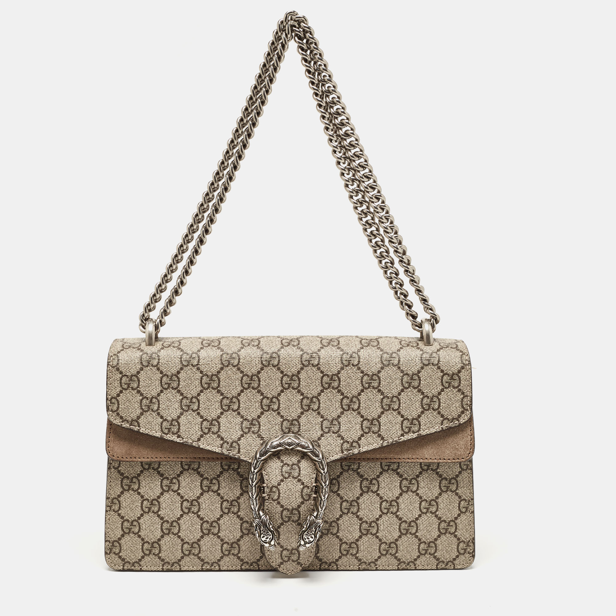 Picture yourself swinging this gorgeous bag at your outings with friends or at social gatherings and imagine how it will not only complement all your outfits but fetch you endless compliments. This Gucci creation has been beautifully crafted from GG Supreme canvas and suede. The flap carries tiger heads with reference to the Greek god Dionysus and it secures suede insides sized to dutifully hold your essentials. The bag is equipped with a chain link just so you can easily flaunt it.