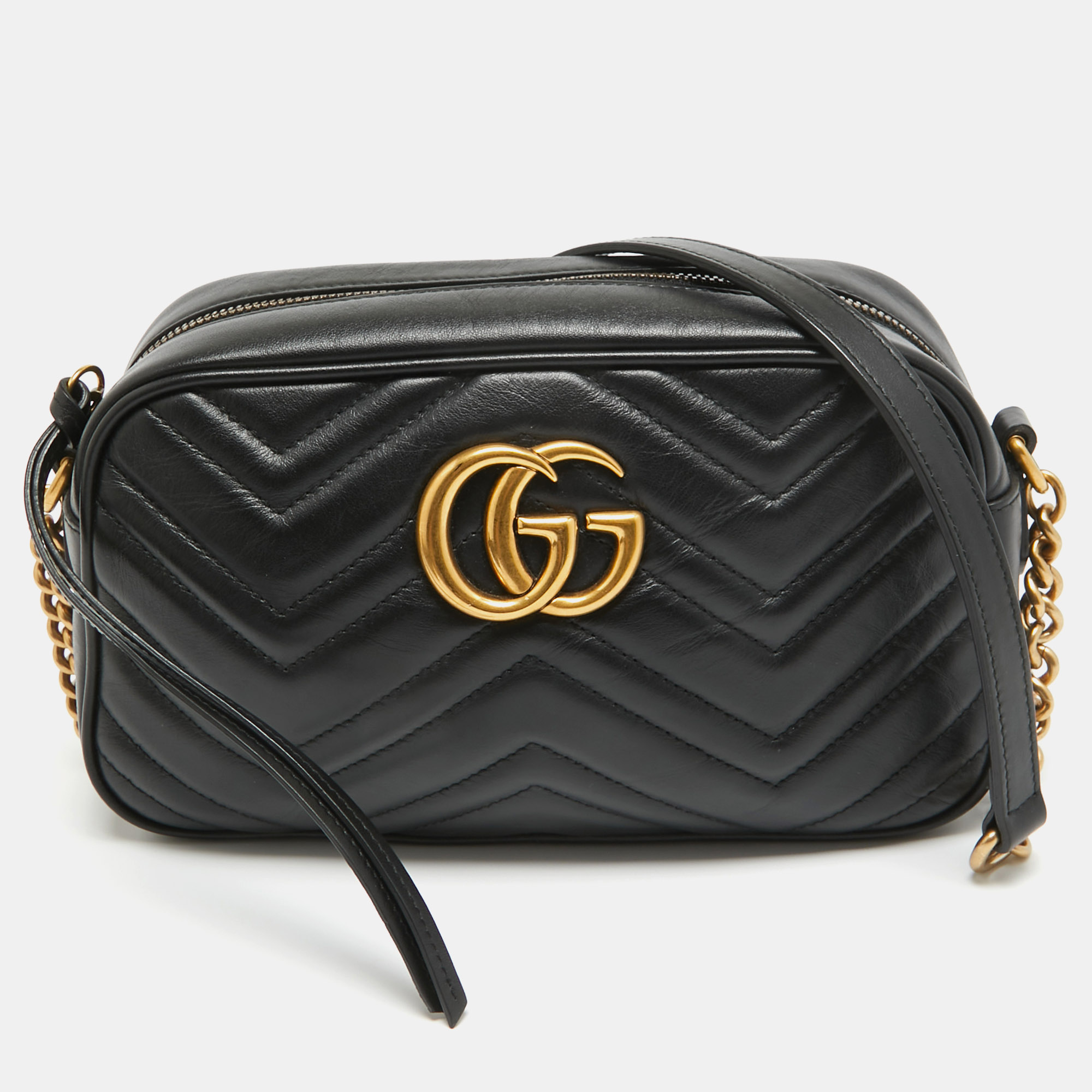 The Gucci bag exudes timeless elegance. Crafted from supple black leather its quilted matelassé pattern is adorned with the iconic GG logo. The shoulder bag seamlessly combines luxury and sophistication making it a must have accessory for the fashion conscious.