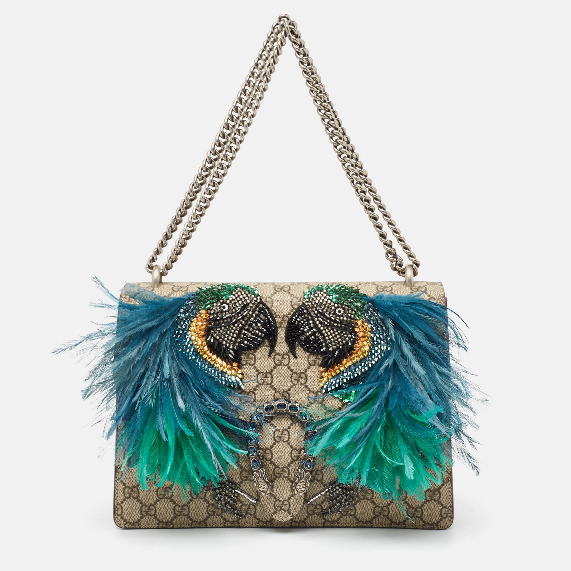 Presenting the Gucci Dionysus shoulder bag a fusion of opulent design and practicality. Crafted with the iconic GG Supreme canvas and lush suede adorned with a striking parrot motif it exudes a captivating charm. Versatile and chic its a timeless accessory for the fashion forward.