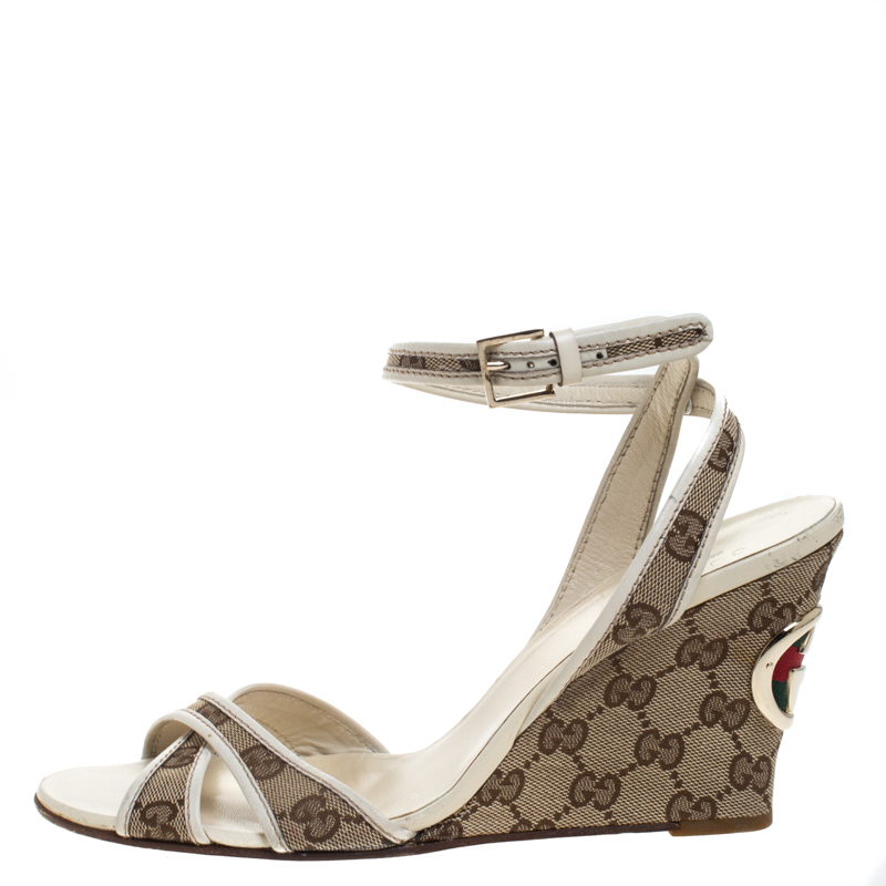 

Gucci Beige GG Canvas Cross Strap Wedge Ankle Strap Sandals Size