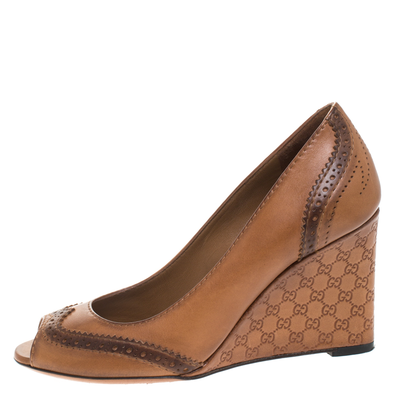 

Gucci Brown Brogue Leather Wedge Peep Toe Pump Size