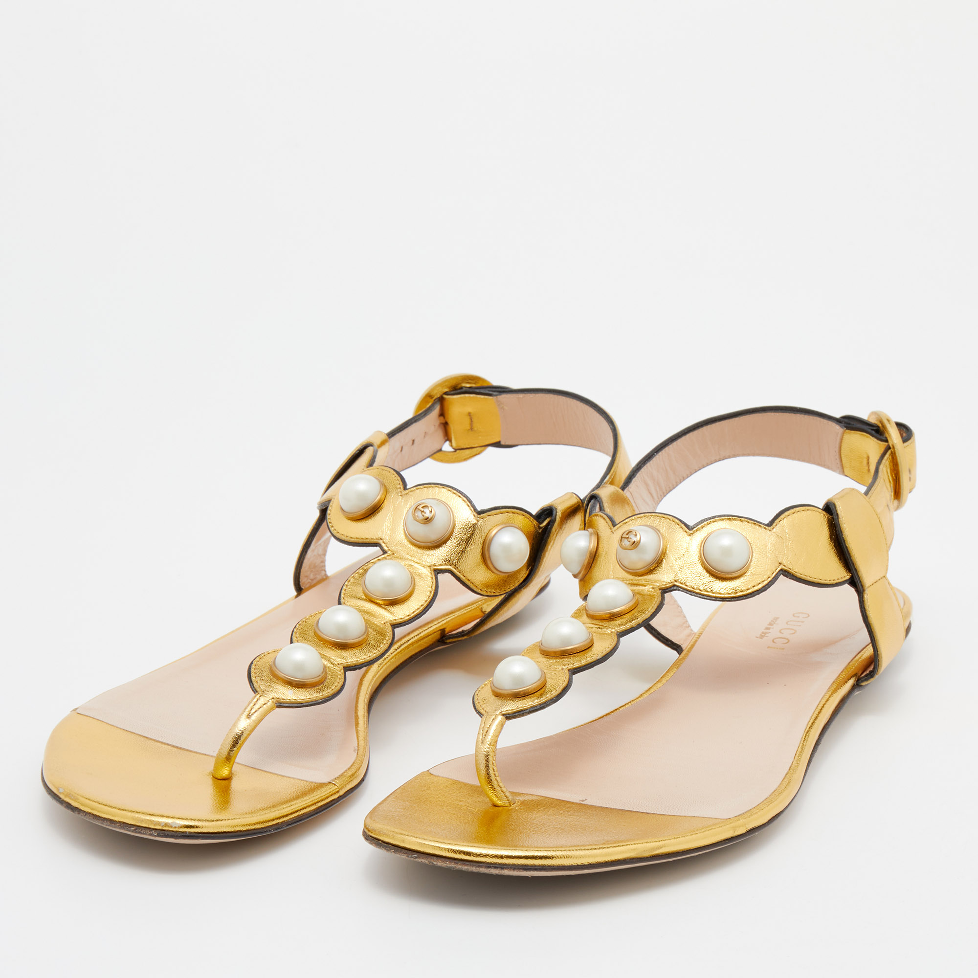 

Gucci Gold Leather Faux Pearl Embellished Willow T Strap Flat Sandals Size