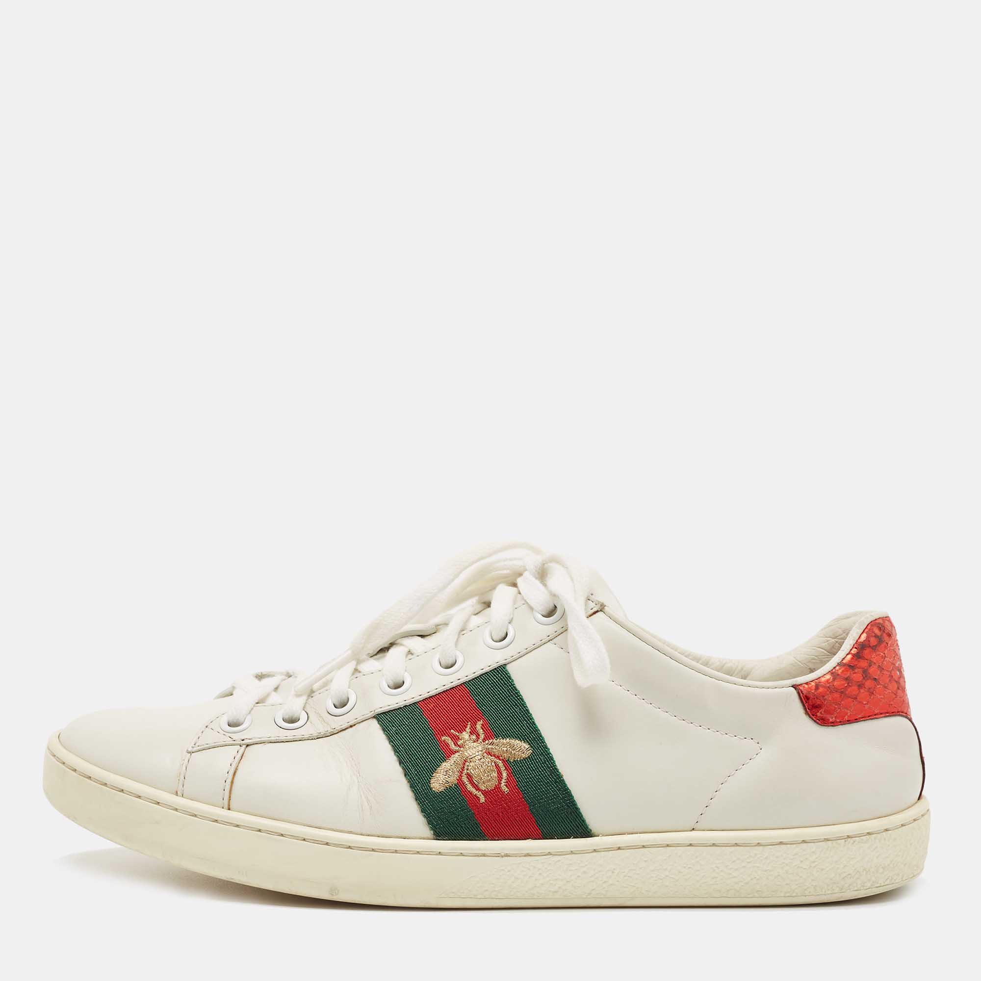 Stacked with signature details this Gucci pair is rendered in leather and is designed with lace up vamps rubber soles and the iconic bee motif on Web stripe. The visual display of this pair is enhanced with contrasting color trims carrying the brand label on the counters.