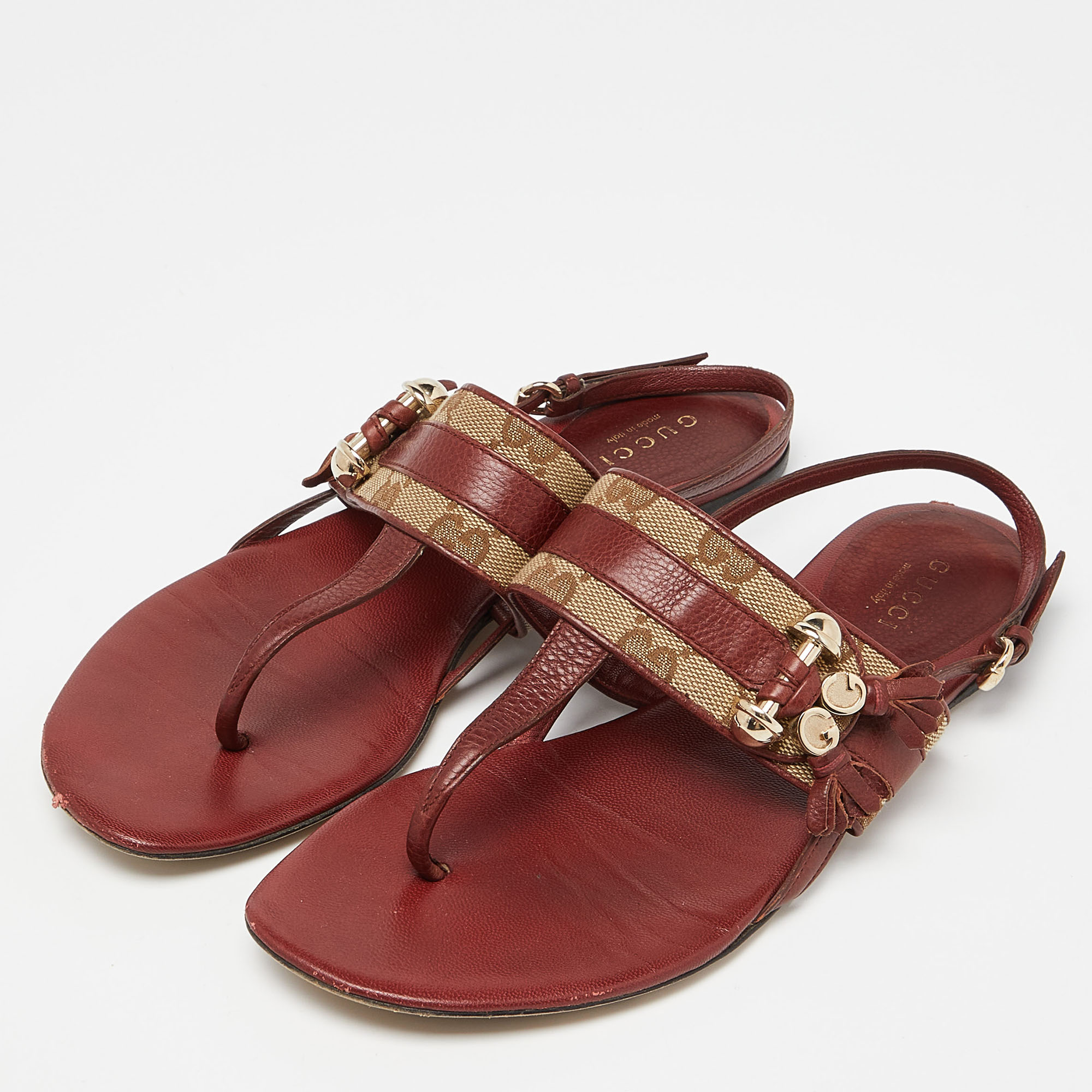 

Gucci Burgundy/Beige Leather and Canvas Thong Flats Size