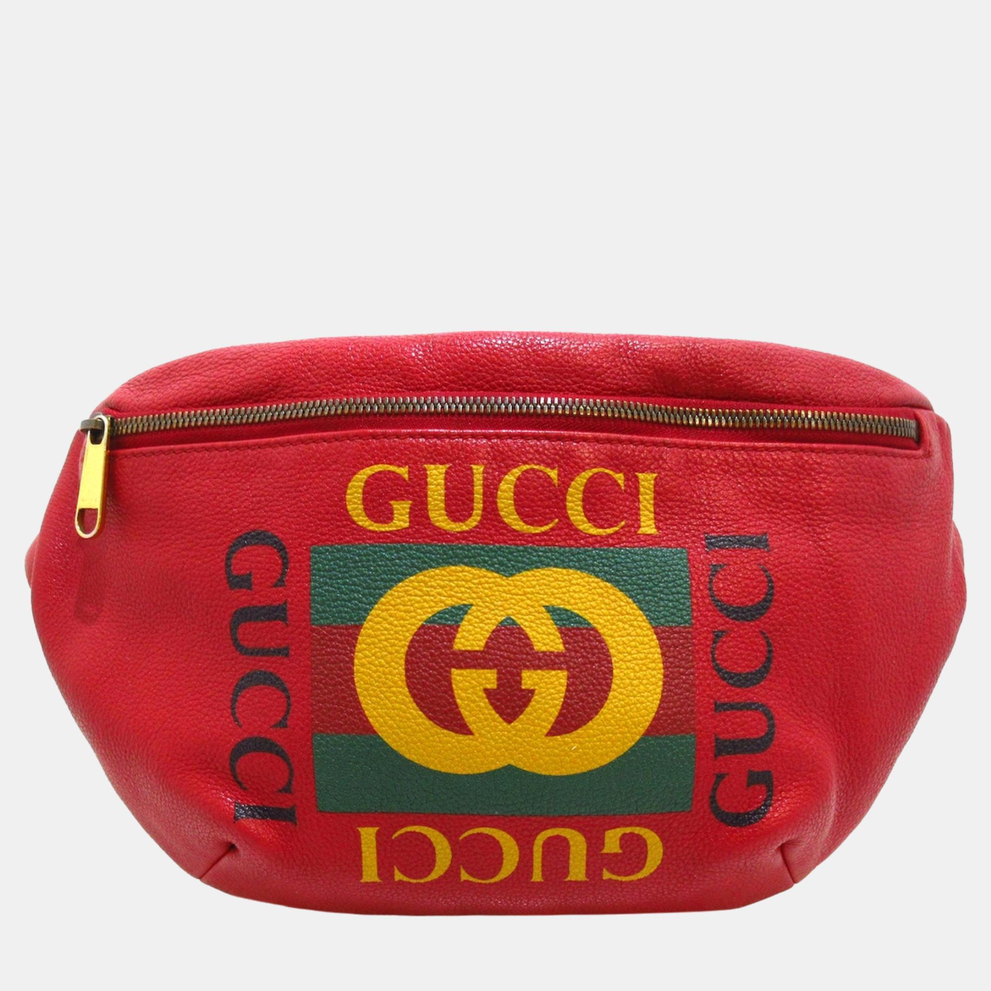 This belt bag features a printed leather body a canvas waist strap with buckle closure and a front zip closure.