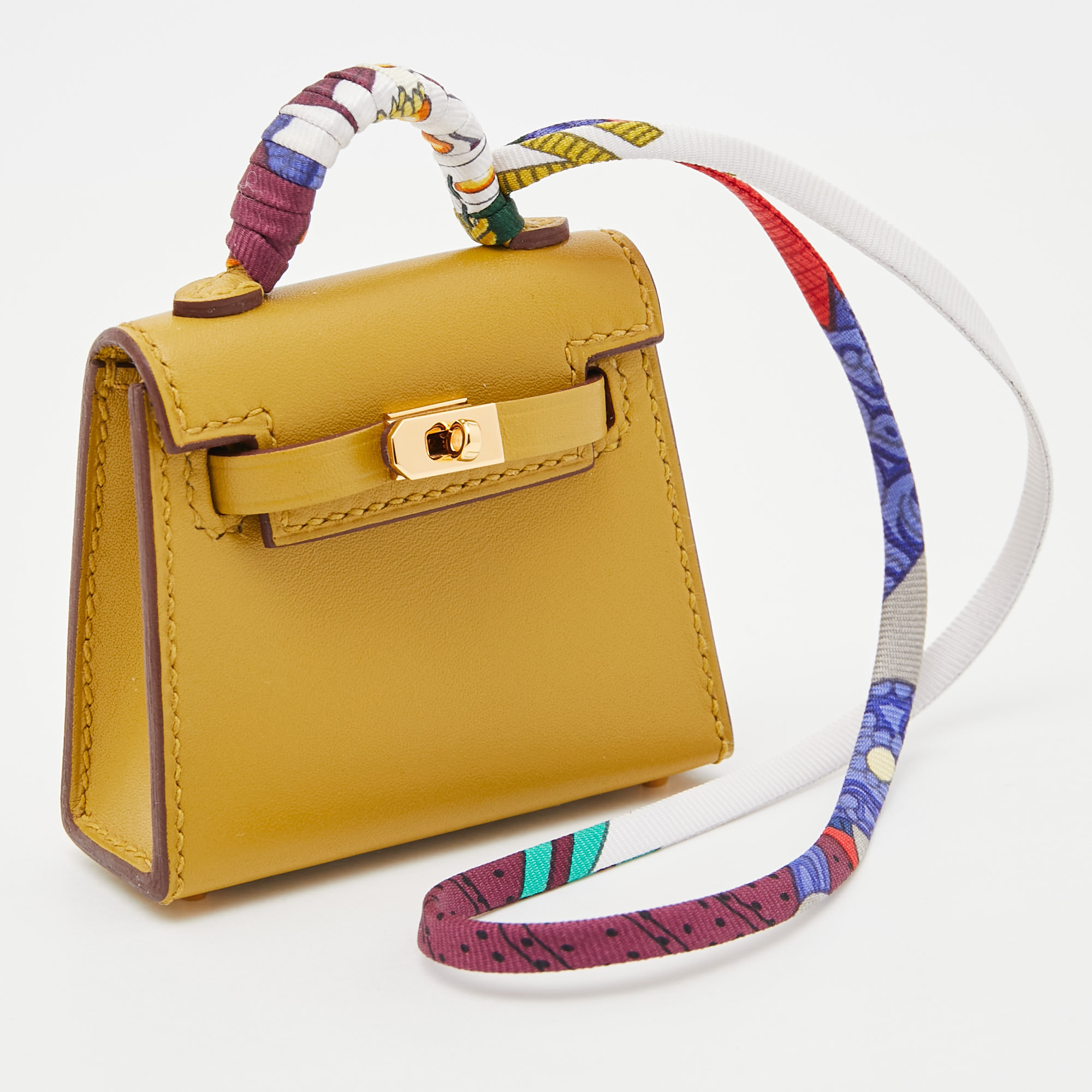 

Hermes Cardamome Tadelakt Leather Mini Kelly Twilly Bag Charm, Yellow