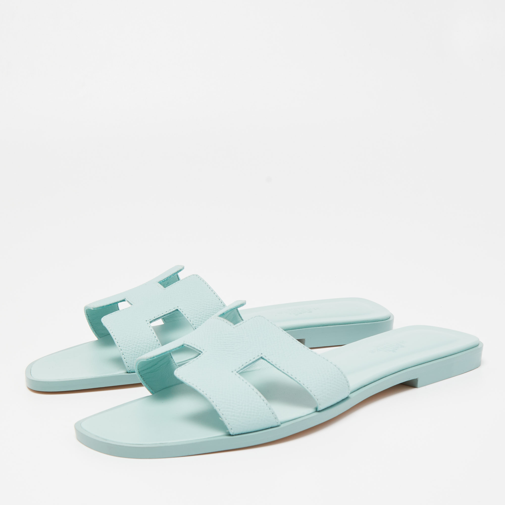 

Hermes Light Blue Leather Oran Flat Slides Size