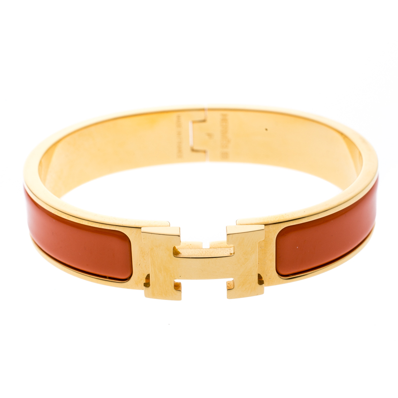 Pre Owned Hermes Clic Clac H Orange Enamel Gold Plated Narrow Bracelet PM