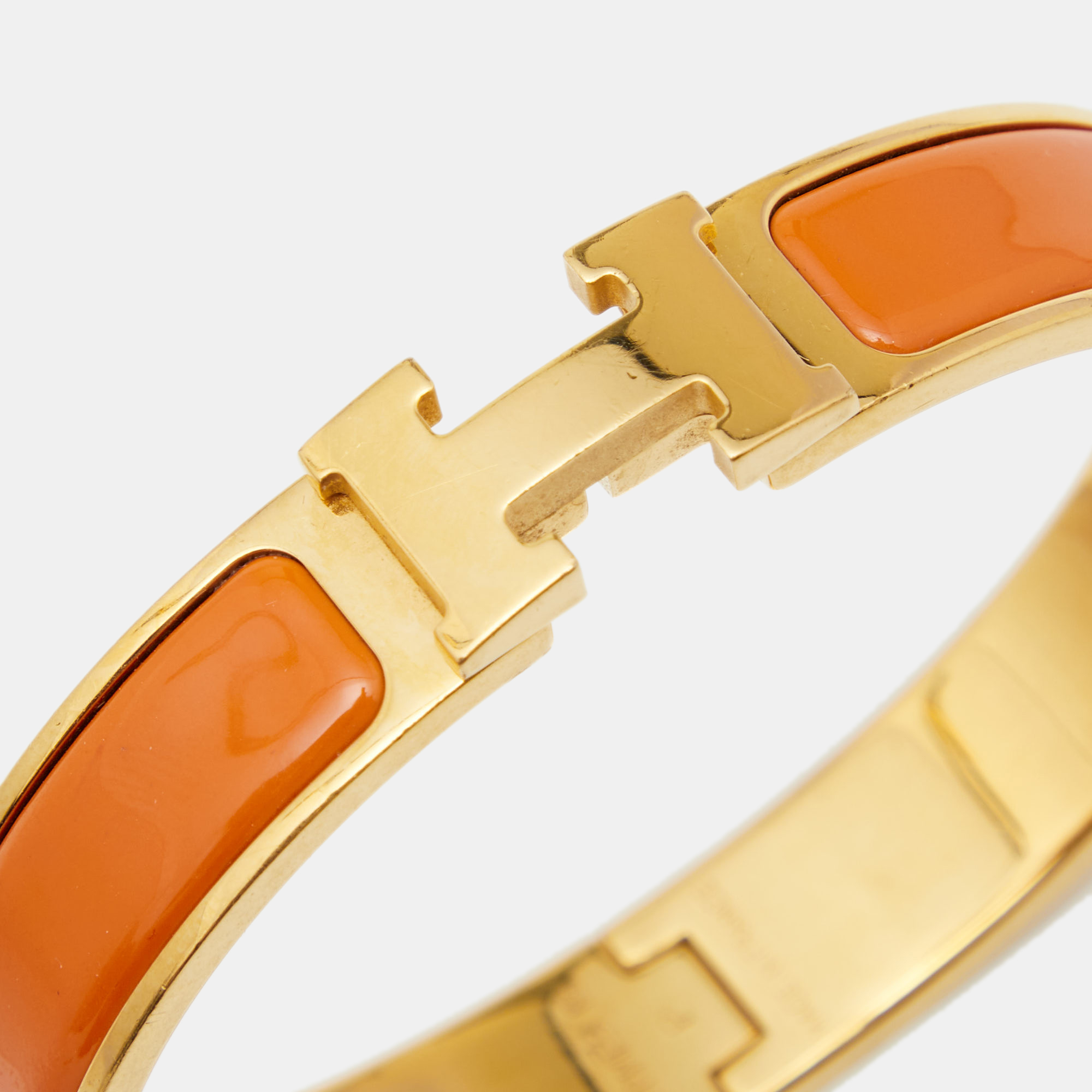 

Hermes Clic H Orange Enamel Gold Tone Metal Bracelet