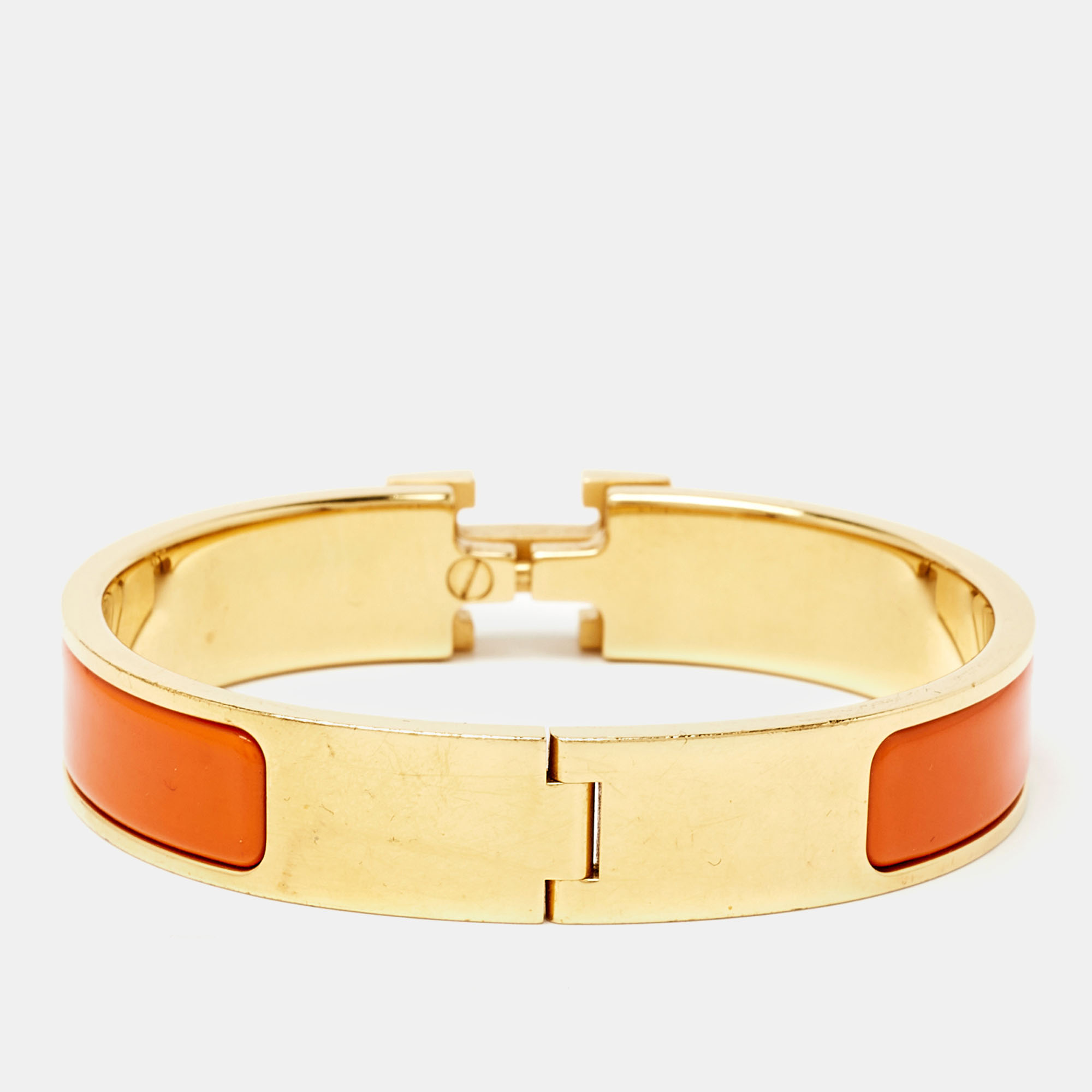 

Hermes Clic H Orange Enamel Gold Tone Bracelet