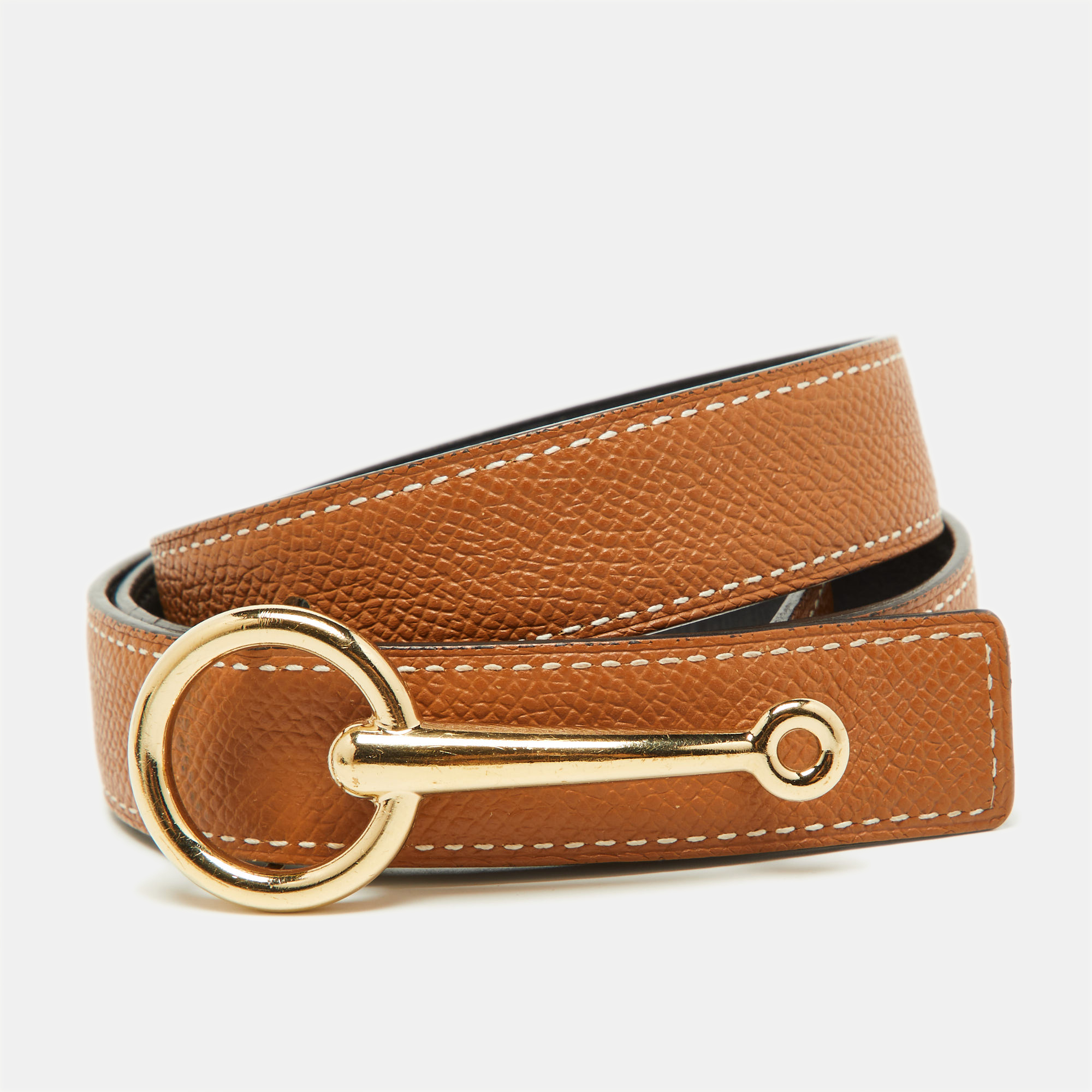 The Hermes Mors buckle belt is a luxurious accessory crafted from premium materials. It features a distinctive buckle symbolizing Hermes elegance and sophistication. This timeless belt effortlessly enhances any outfit making it a coveted choice for fashion enthusiasts seeking both style and refinement.