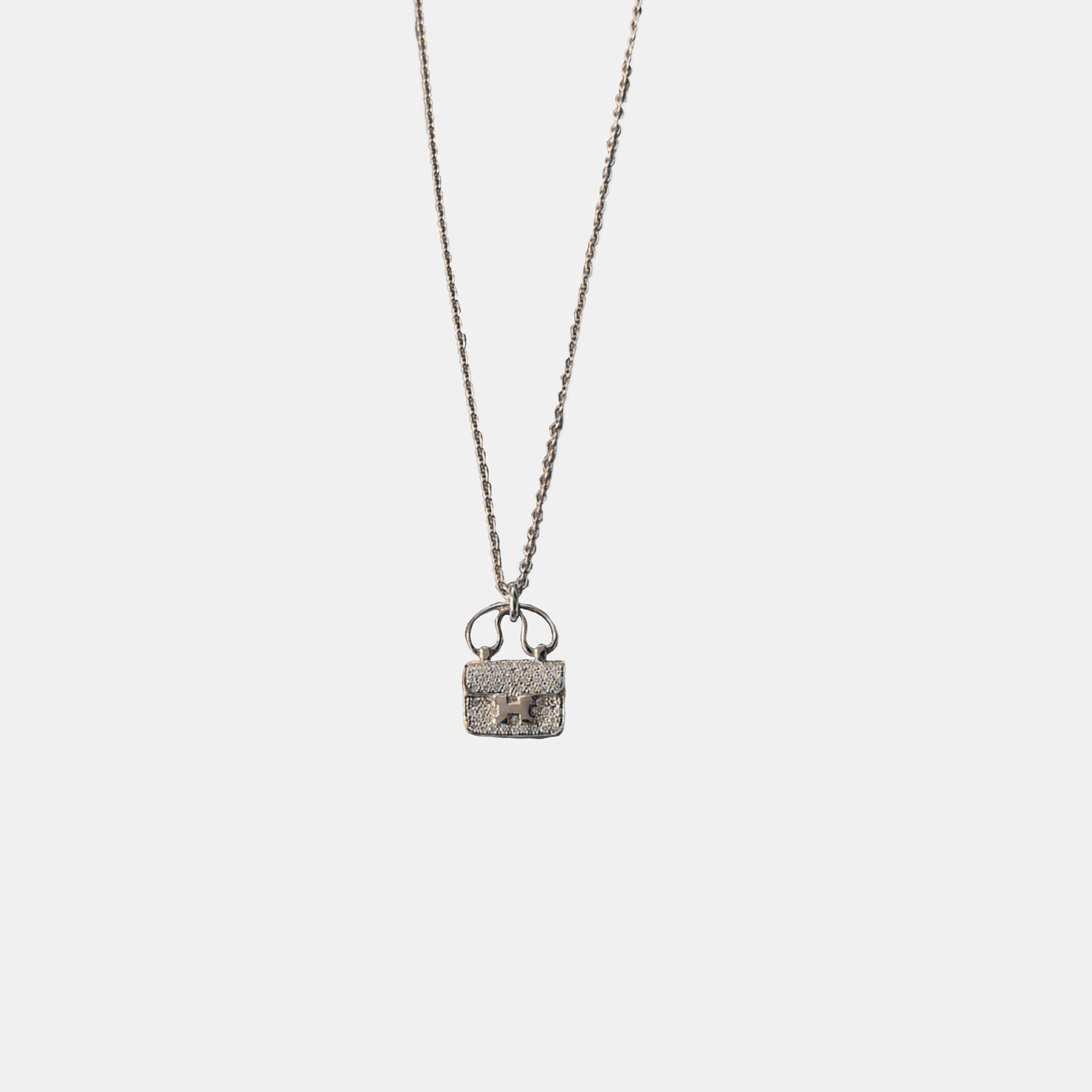

Hermes Rose Gold and Diamond Constance Amulette Pendant