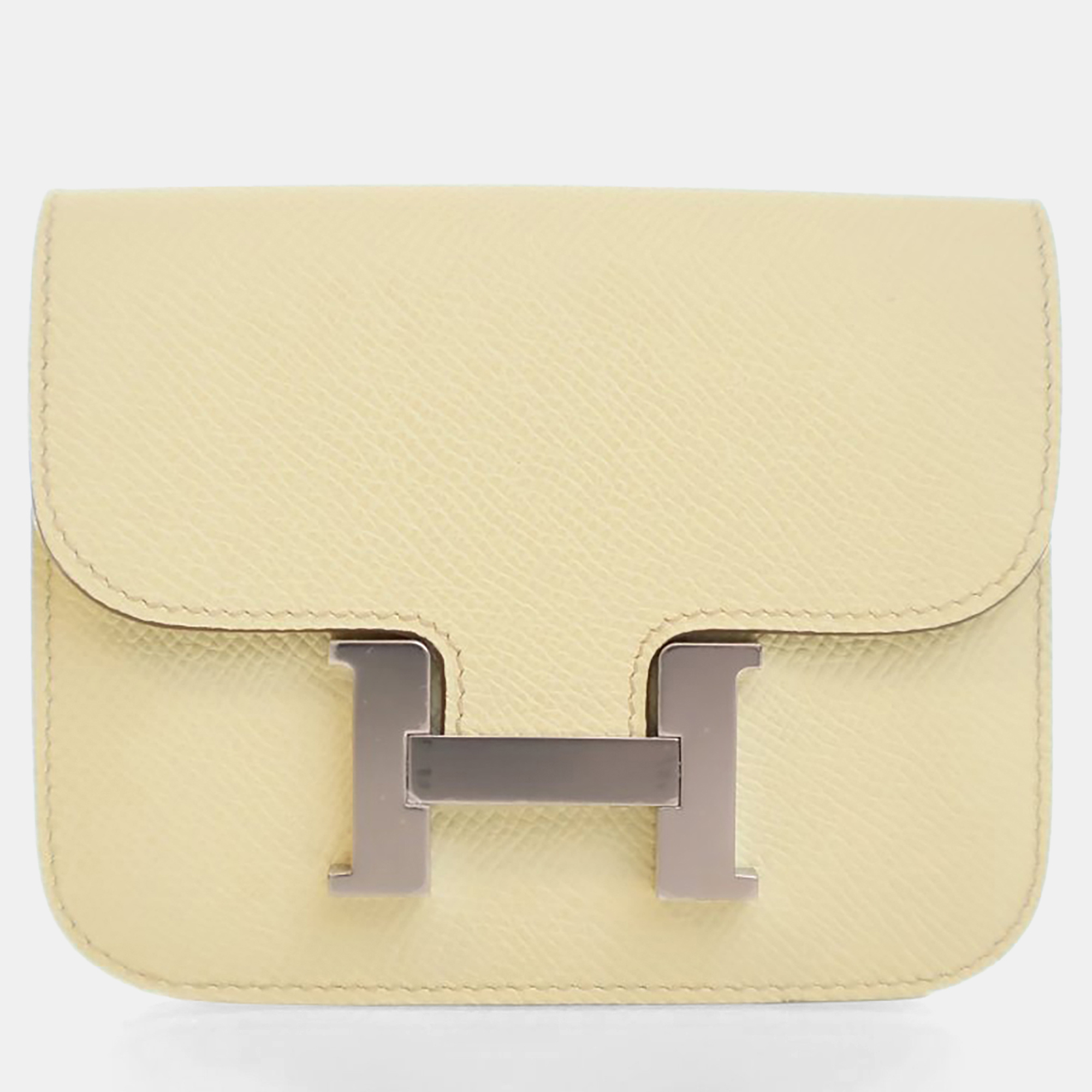 Click to view more detailed imagery on our partner's website Pre-owned Hermes Jaune Poussin Constance Slim Wallet In Yellow