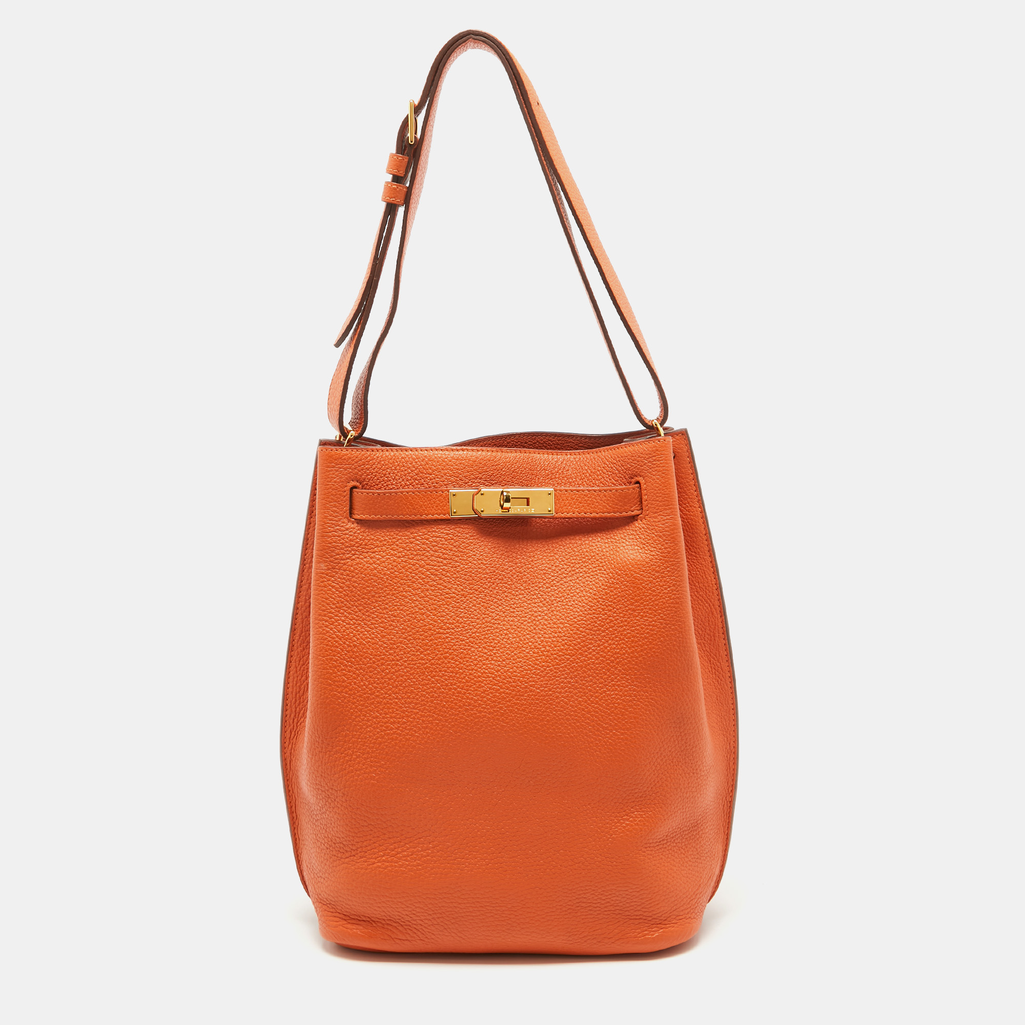 The elegant and timeless elements of the iconic Kelly are coupled with a more casual silhouette in this coveted So Kelly bag. It is crafted from Togo leather in a bucket like shape with the signature Kelly lock in gold tone metal on the front and an adjustable shoulder handle attached to the top. Its spacious interior is lined with leather and equipped with pockets for your little belongings. Complement your outfits with this stunner.