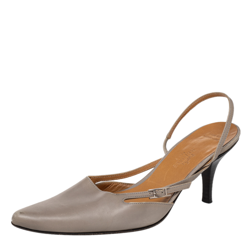 Be a trendsetter by waltzing out in this exquisite Hermes pair. Crafted from leather these fabulous grey beauties feature pointed toes high heels and slingbacks. Slip them on over simple outfits and let these sandals have the spotlight.